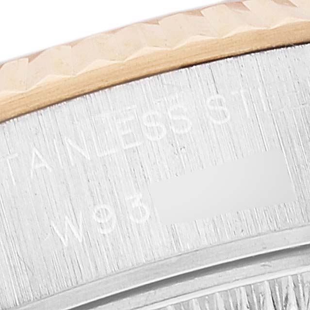 This close-up angle shows the engraved side of the bezel on a Rolex Datejust 69173 Women's Steel and Gold (two tone) Champagne Dial 69173 Women's Steel and Gold (two tone) Champagne Dial watch.