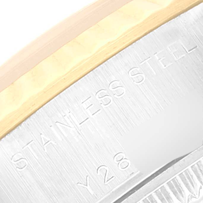 The image shows a close-up of the side engraving on the case of a Rolex Datejust 79173 Women's Steel and Gold (two tone) Champagne Dial 79173 Women's Steel and Gold (two tone) Champagne Dial watch, highlighting the "STAINLESS STEEL" text.
