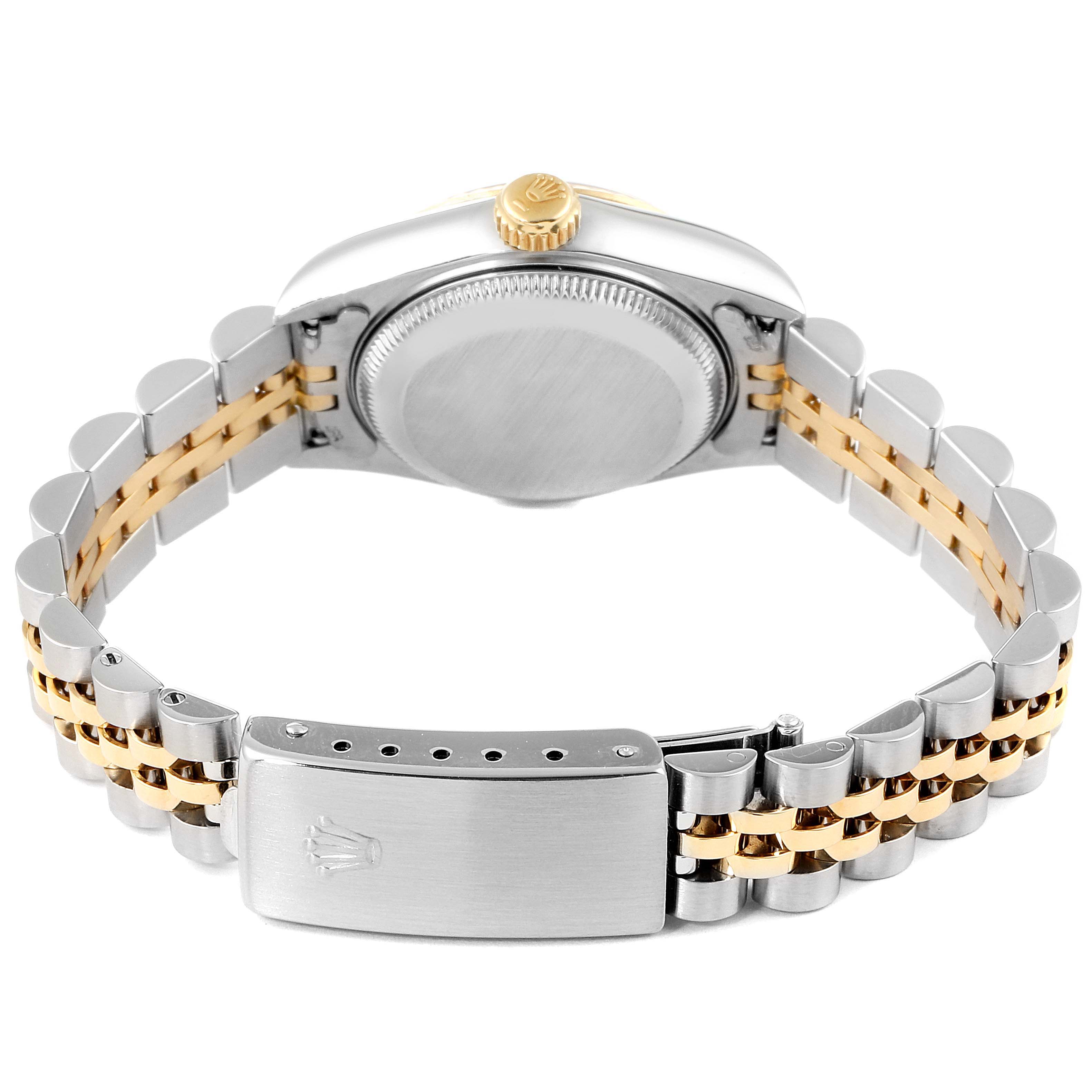 The image shows the back view of a Rolex Datejust 69173 Women
s Steel and Gold (two tone) Champagne Dial 69173 Women
s Steel and Gold (two tone) Champagne Dial watch, highlighting its bracelet, clasp, caseback, and crown.