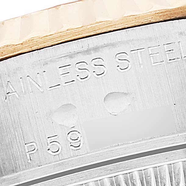 This is a close-up view of the engraving on the side of a Rolex Datejust 79173 Women's Steel and Gold (two tone) Silver Dial 79173 Women's Steel and Gold (two tone) Silver Dial watch casing.