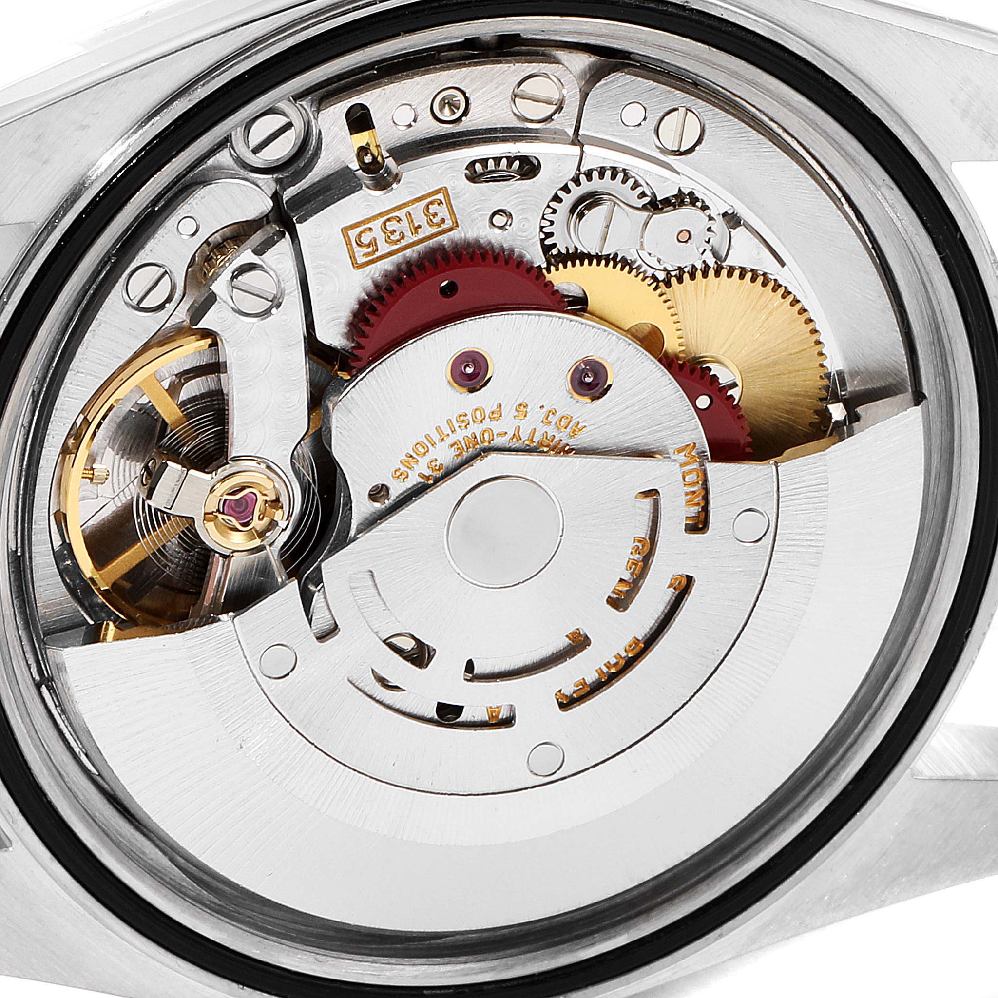 The image shows a close-up view of the internal mechanism of a Rolex Datejust 16233 Men's Steel and Gold (two tone) Champagne Dial 16233 Men's Steel and Gold (two tone) Champagne Dial watch, revealing gears and calibrations.