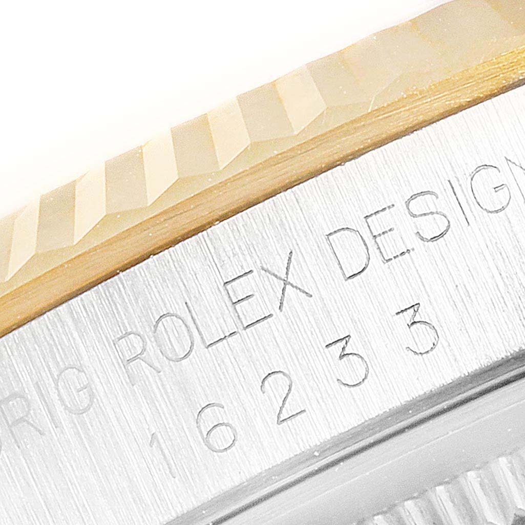 This image shows a close-up of the bezel and the model inscription on a Rolex Datejust 16233 Men's Steel and Gold (two tone) Champagne Dial 16233 Men's Steel and Gold (two tone) Champagne Dial watch.
