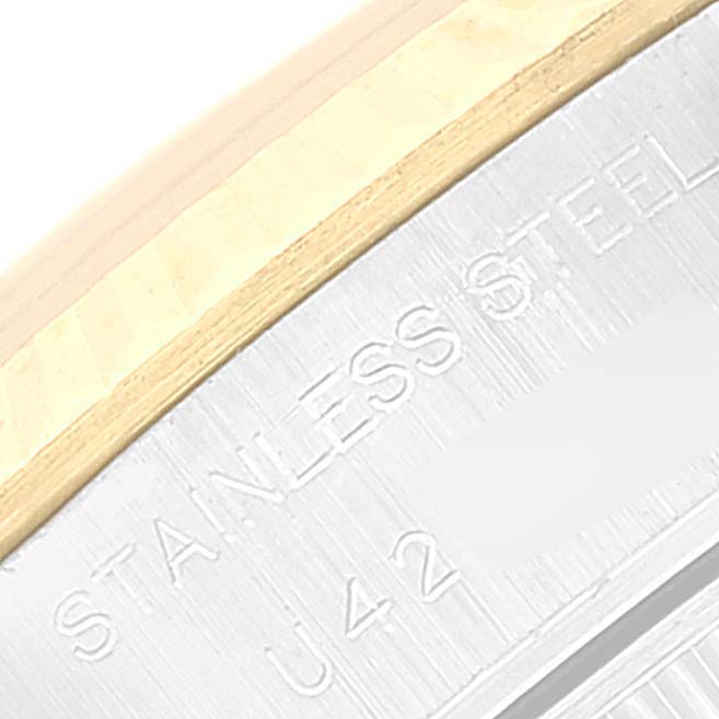 This image shows a close-up of the stainless steel case back of a Rolex Datejust 69173 Women's Steel and Gold (two tone) Grey Dial 69173 Women's Steel and Gold (two tone) Grey Dial watch at an angled view.