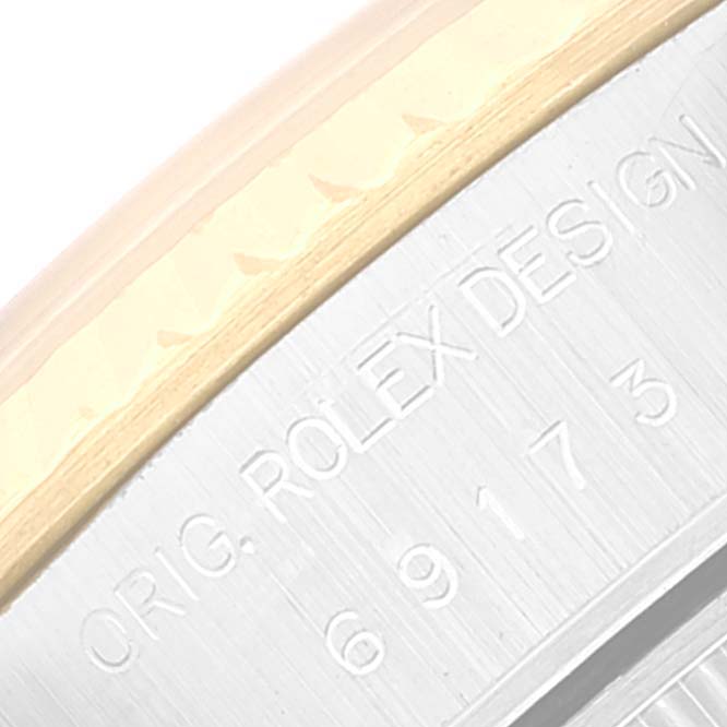 The image shows a close-up of the bezel and side engraving on a Rolex Datejust 69173 Women's Steel and Gold (two tone) Grey Dial 69173 Women's Steel and Gold (two tone) Grey Dial watch.