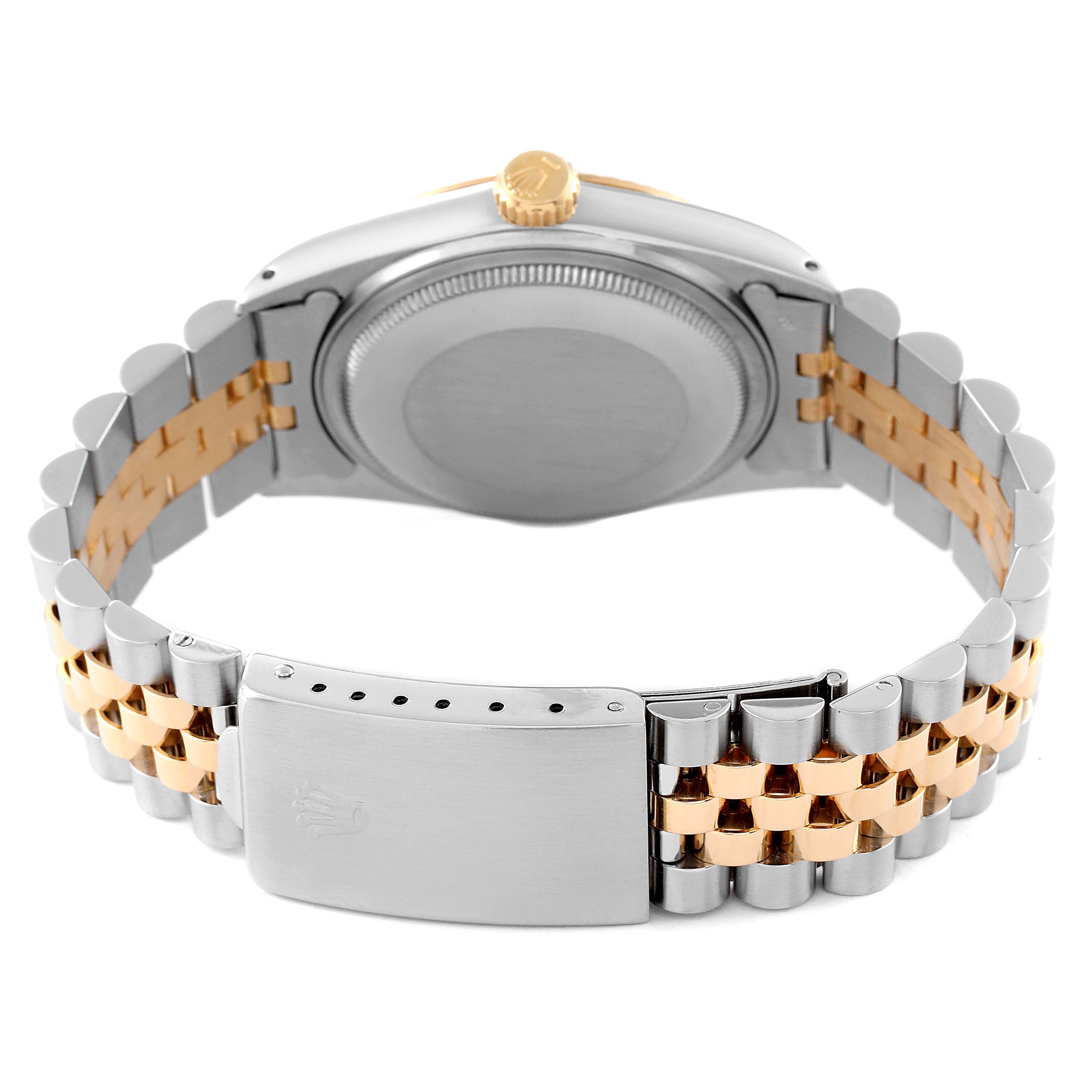 This image shows the back and bracelet of a Rolex Datejust 16013 Men's Steel and Gold (two tone) White Dial 16013 Men's Steel and Gold (two tone) White Dial watch, highlighting its clasp and crown at a rear angle.