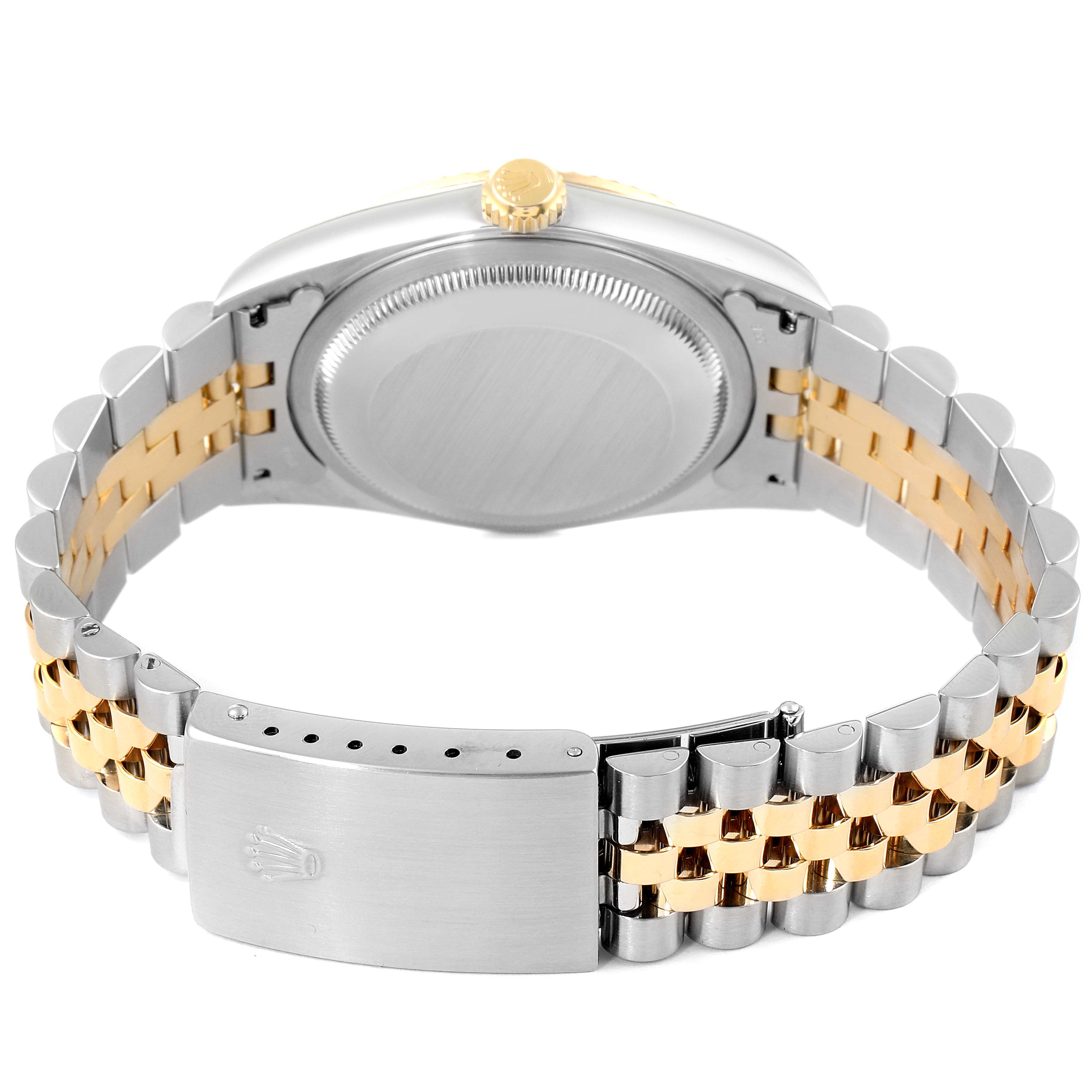 This image shows the backside of the Rolex Datejust 16233 Men's Steel and Gold (two tone) White Dial 16233 Men's Steel and Gold (two tone) White Dial watch, including the clasp, bracelet, and case back.