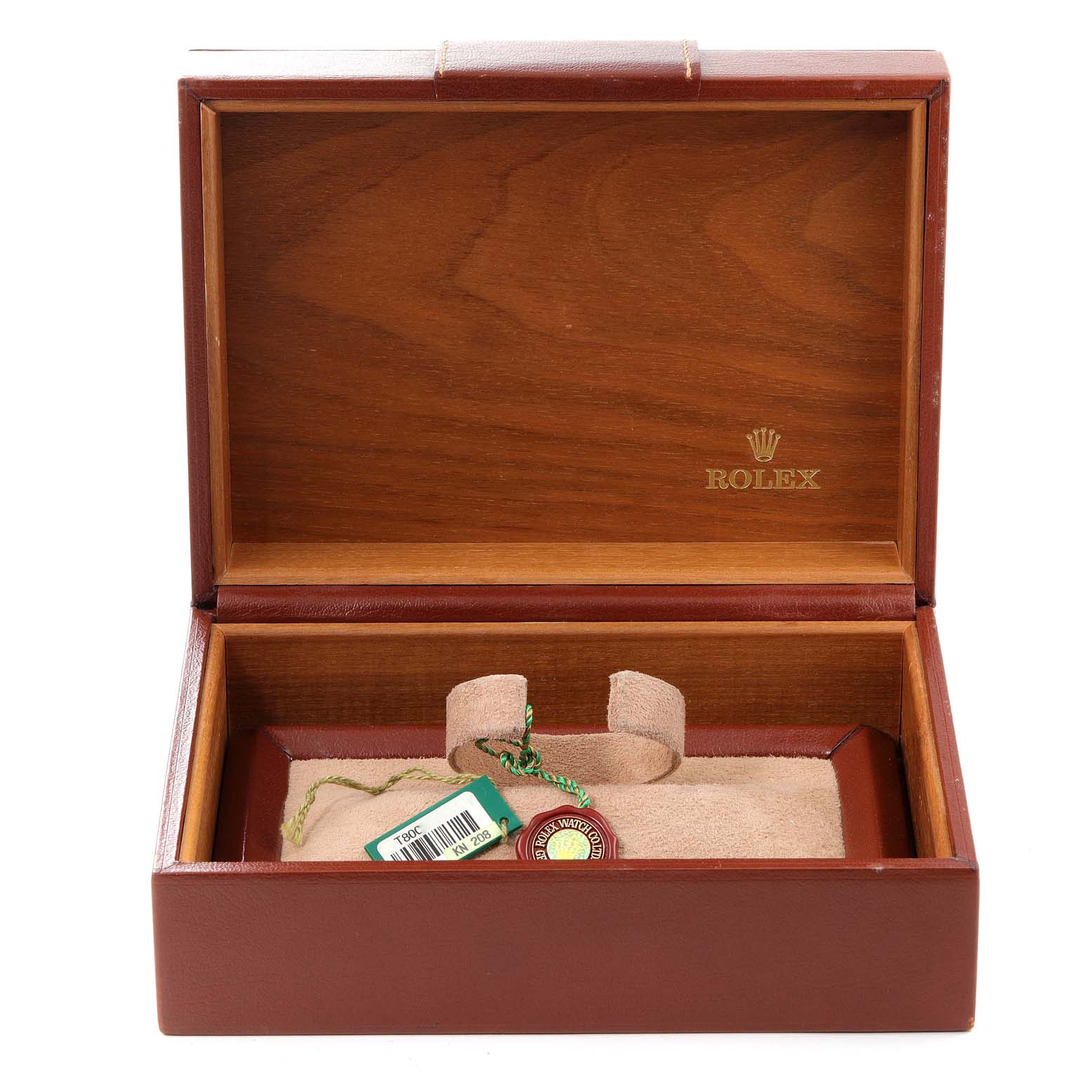 The image shows an open Rolex watch box for the President model, with a tag and seal inside.