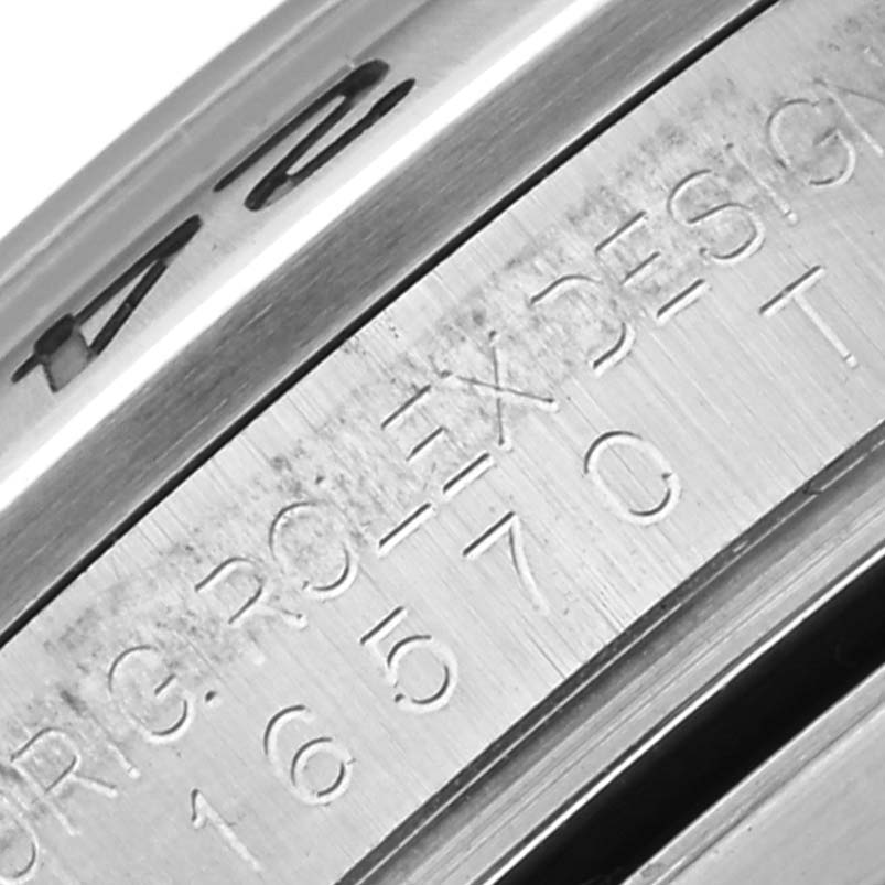 The image shows a close-up of the side engraving on the bezel of a Rolex Explorer 16570 Men's Stainless Steel White Dial 16570 Men's Stainless Steel White Dial watch.