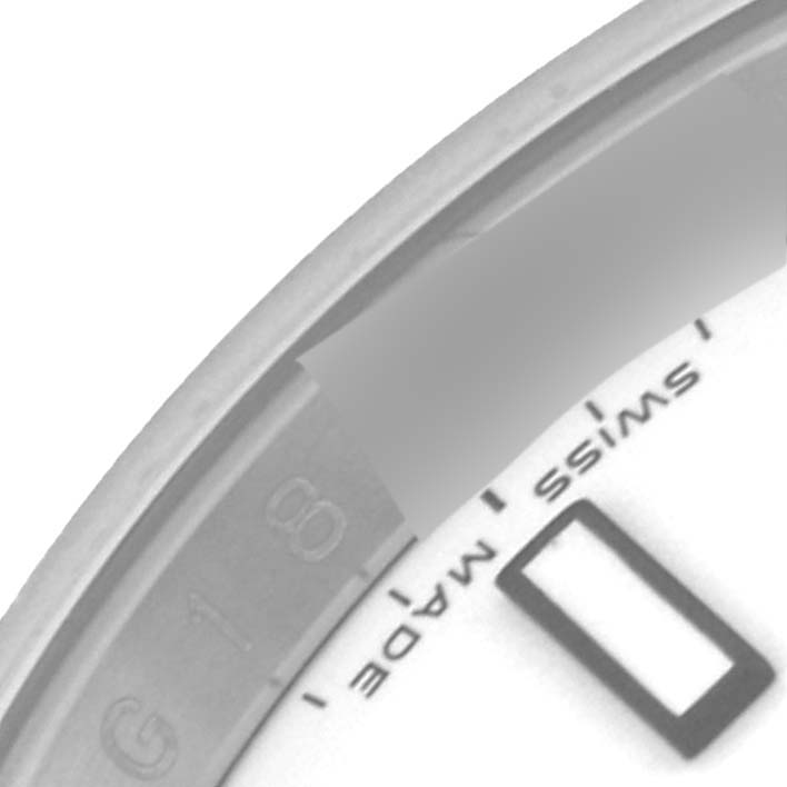 The image shows a close-up of the bezel and part of the dial of a Rolex Explorer 16570 Men's Stainless Steel White Dial 16570 Men's Stainless Steel White Dial watch, highlighting details like "Swiss Made."