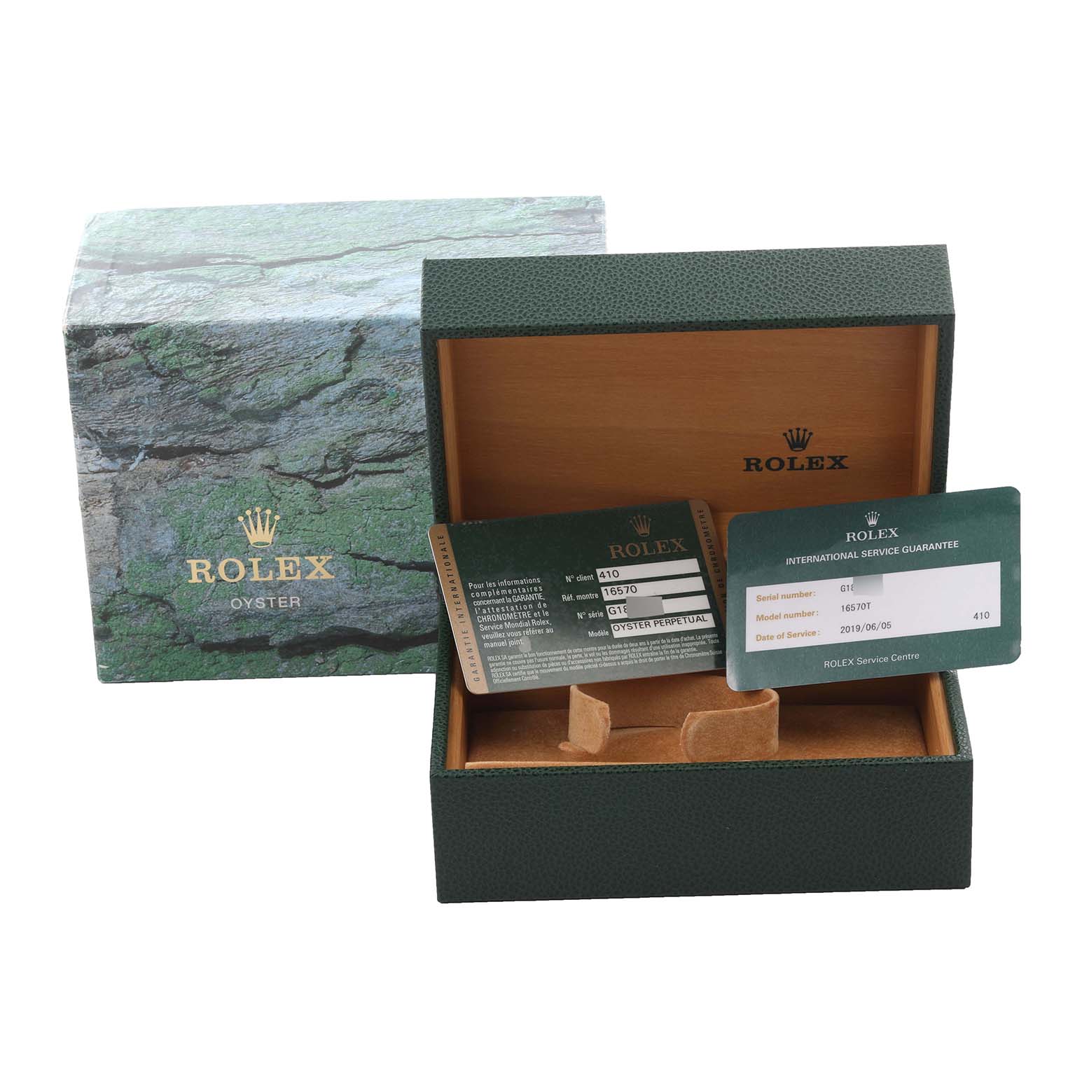 The image shows the packaging and guarantee cards for a Rolex Explorer 16570 Men's Stainless Steel White Dial 16570 Men's Stainless Steel White Dial watch, with the box lid open.