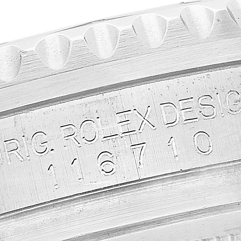 This close-up image displays the engraved case back of a Rolex GMT-Master 116710 Men
s Stainless Steel Black Dial 116710 Men
s Stainless Steel Black Dial, showing part of the model number 116710.