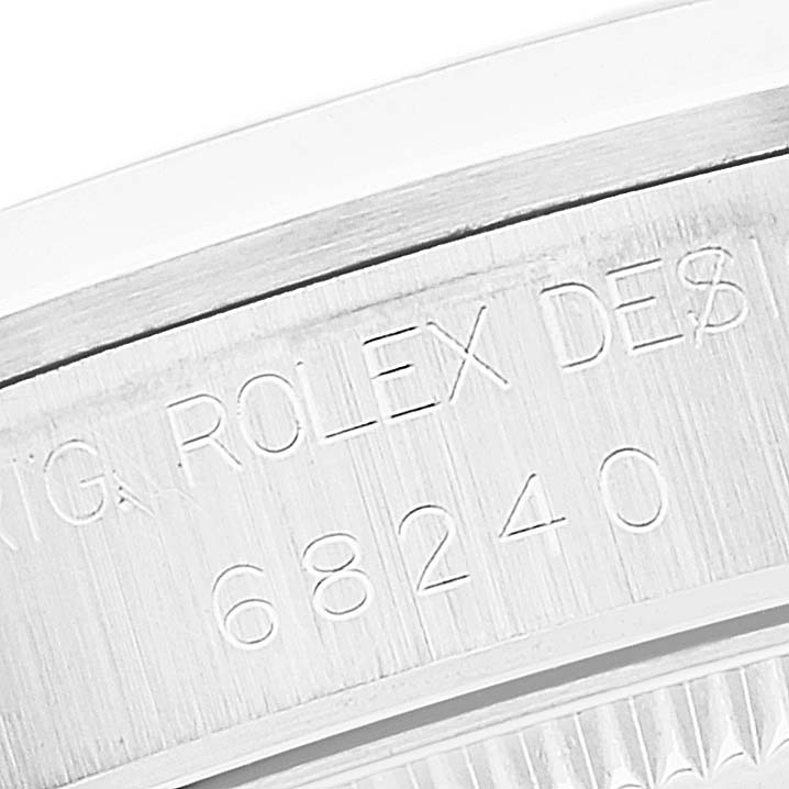 This image shows an engraved part of the bezel or case back of a Mid-Size Rolex model 68240.