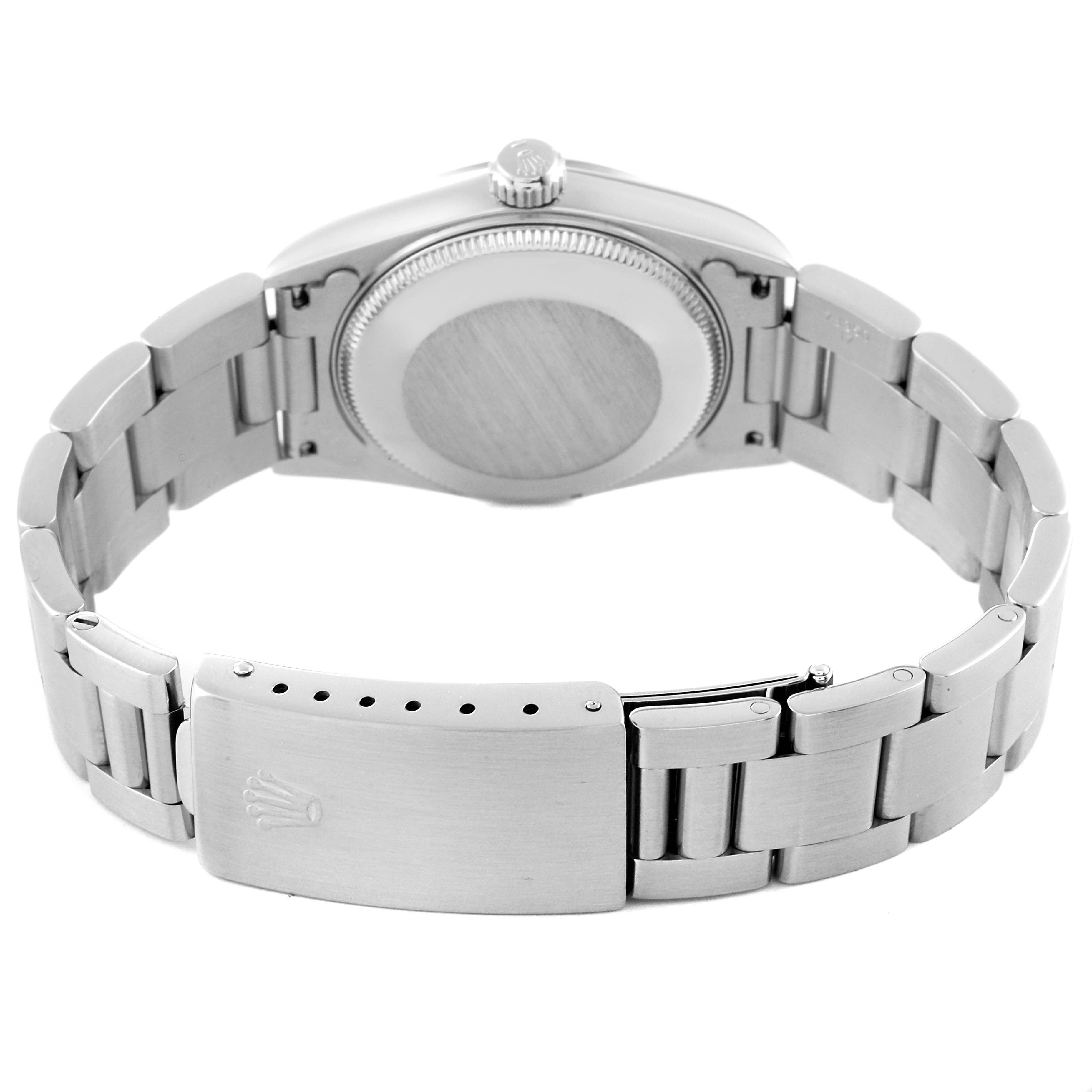 This image shows the case back, bracelet, and clasp of a Rolex Mid-Size 68240 Women's Stainless Steel Black Dial 68240 Women's Stainless Steel Black Dial model from a rear angle.