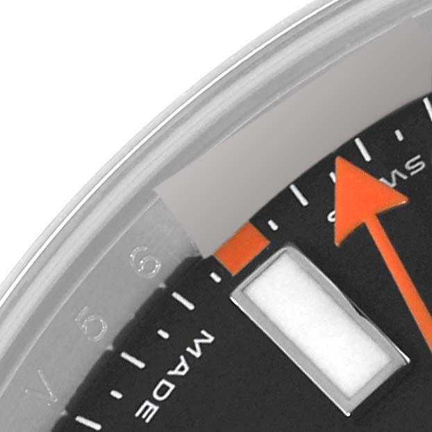 The image shows a close-up of the dial and orange seconds hand of a Rolex Milgauss 116400 Men's Stainless Steel Black Dial 116400 Men's Stainless Steel Black Dial watch.