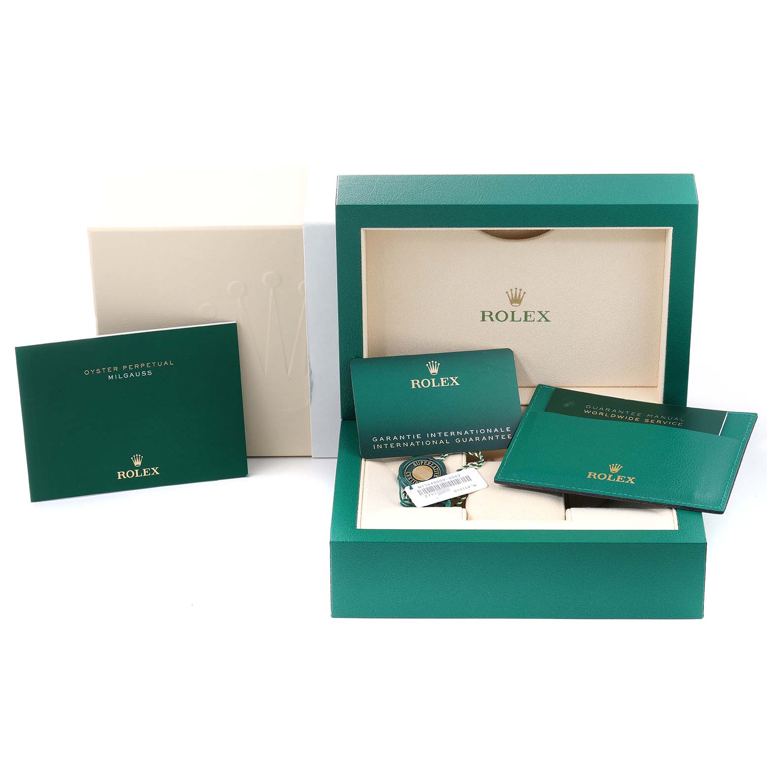 The image shows the packaging and accessories of a Rolex Milgauss 116400GV Men
s Stainless Steel Blue Dial 116400GV Men
s Stainless Steel Blue Dial watch, including the box, manuals, and guarantee card.