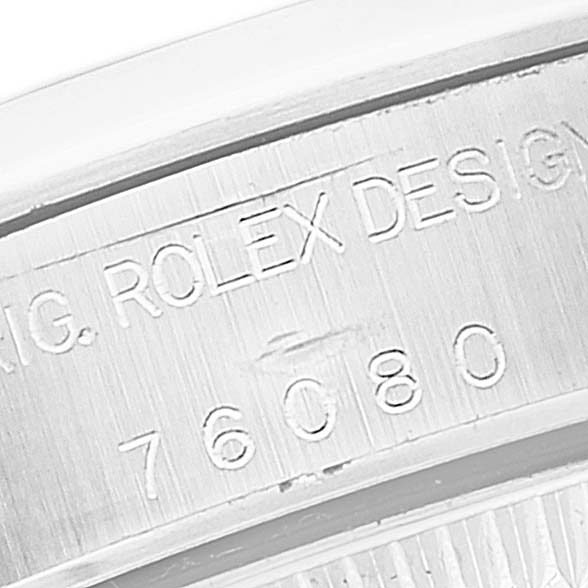 The image shows a close-up of the engraved inner caseback of a Rolex Oyster Perpetual 76080 Women's Stainless Steel Black Dial 76080 Women's Stainless Steel Black Dial watch, displaying the model number.