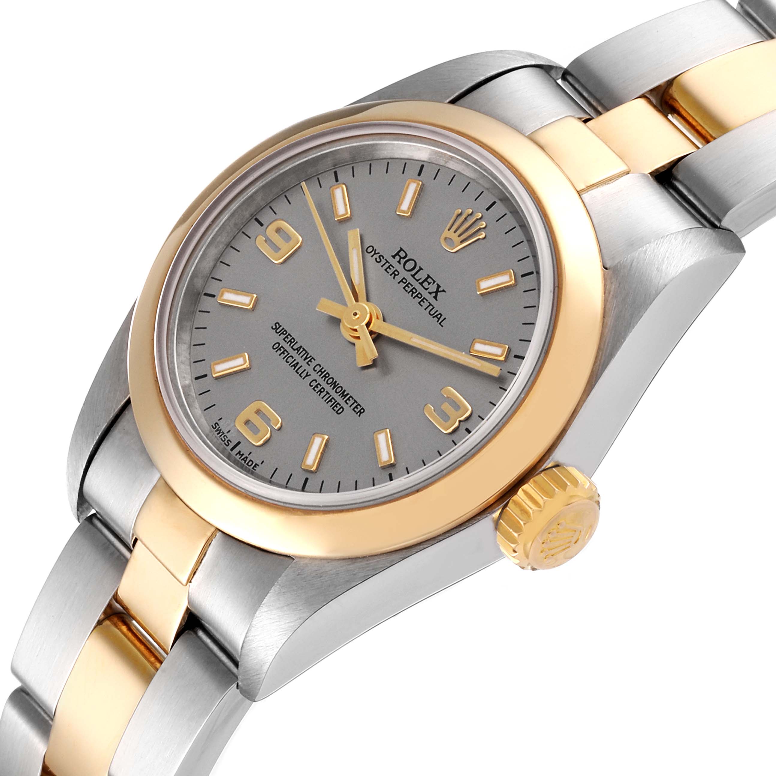 This Rolex Oyster Perpetual 67183 Women's Steel and Gold (two tone) Silver Dial 67183 Women's Steel and Gold (two tone) Silver Dial watch is shown from an angled side view, highlighting the dial, bezel, crown, and part of the bracelet.