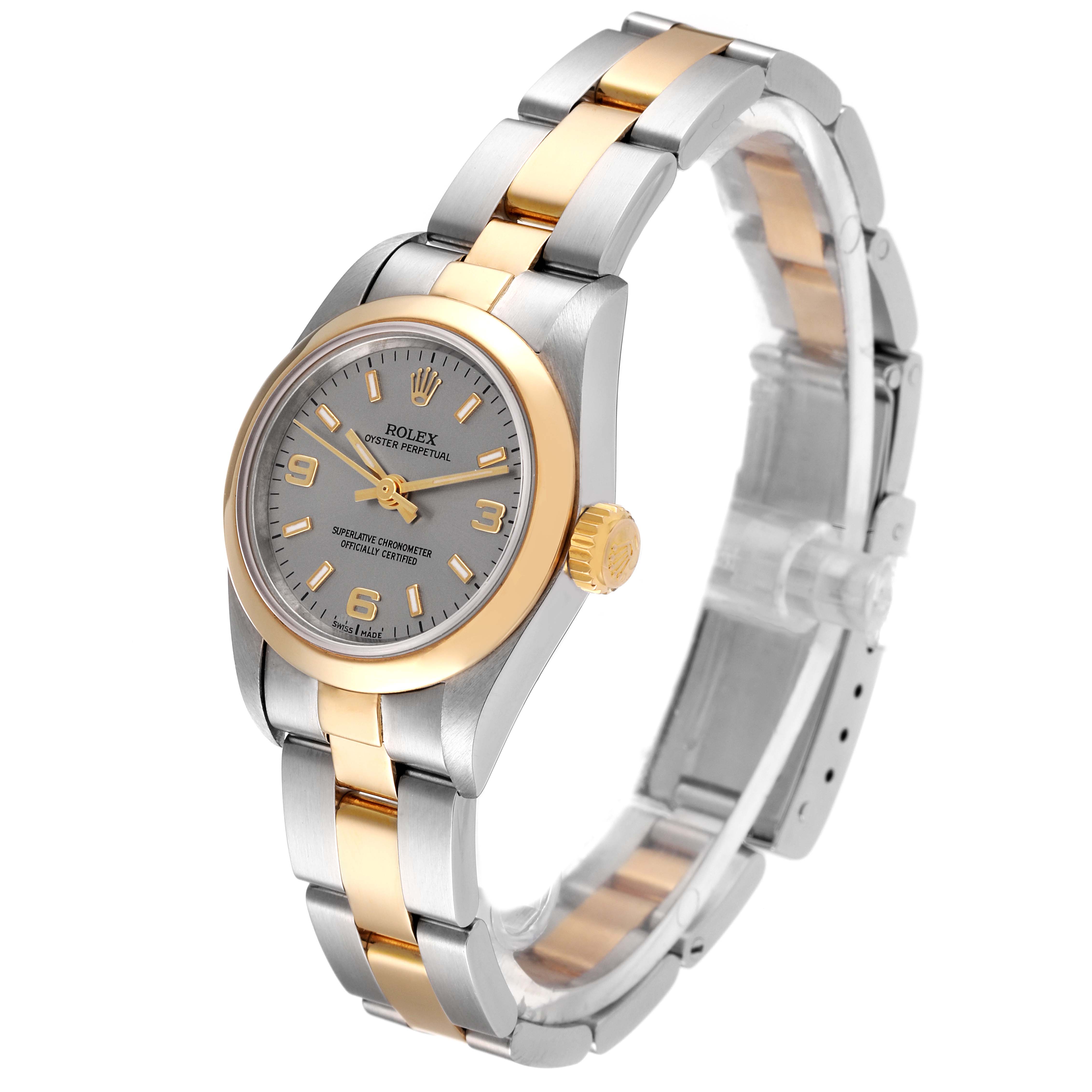 The image shows a Rolex Oyster Perpetual 67183 Women's Steel and Gold (two tone) Silver Dial 67183 Women's Steel and Gold (two tone) Silver Dial watch at a slight angle highlighting its silver and gold bracelet and grey dial.
