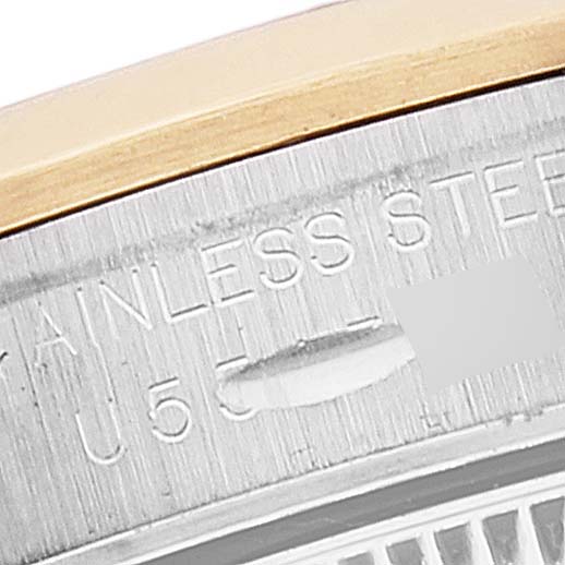 The image shows a close-up of the side and part of the back of a Rolex Oyster Perpetual 67183 Women's Steel and Gold (two tone) Silver Dial 67183 Women's Steel and Gold (two tone) Silver Dial watch, highlighting the stainless steel marking.