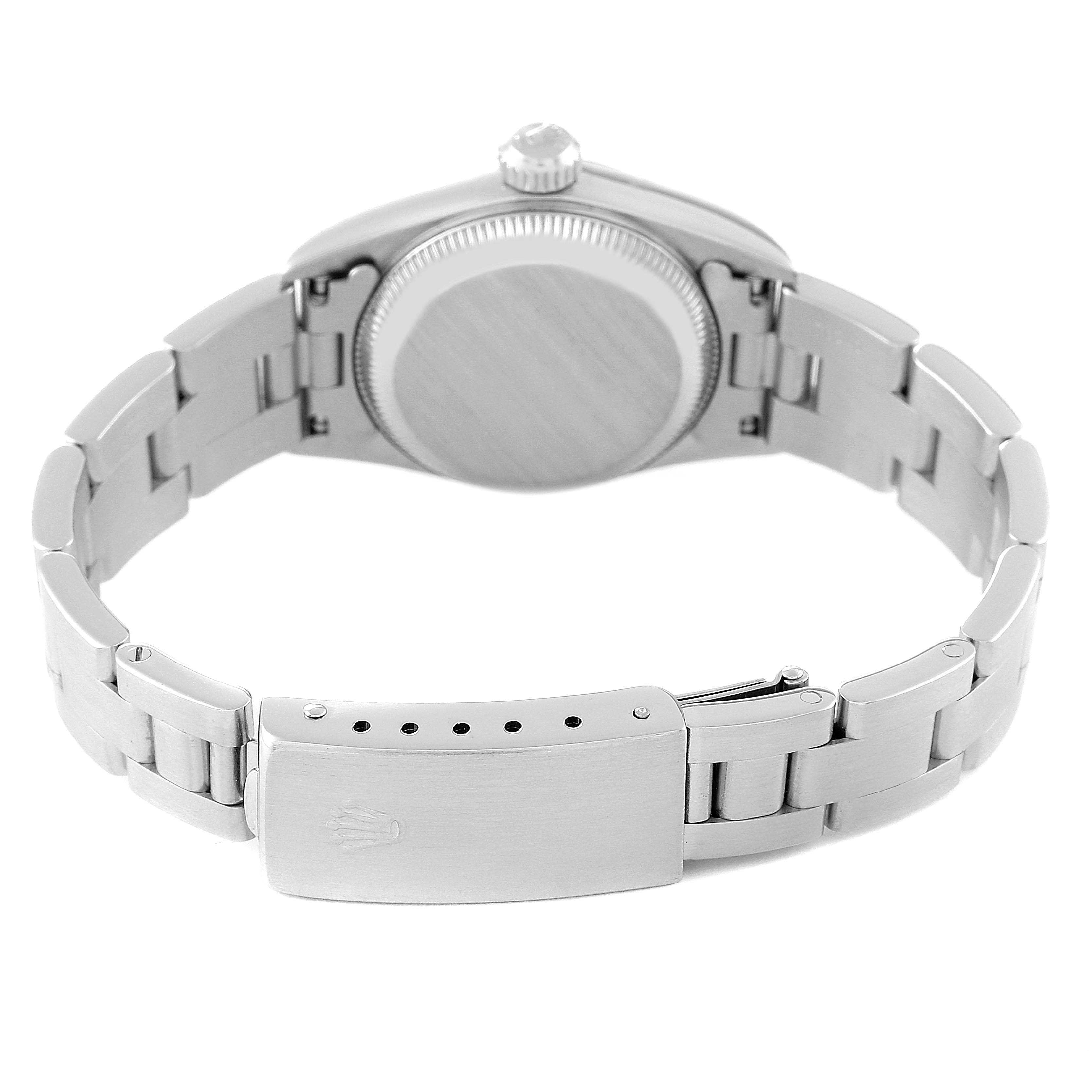 This Rolex Oyster Perpetual 67180 Women's Stainless Steel Blue Dial 67180 Women's Stainless Steel Blue Dial watch is shown from the back, highlighting the case back and bracelet with deployment clasp.