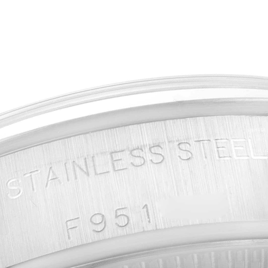This is a close-up angle of the back case of a Rolex Oyster Perpetual 76080 Women
s Stainless Steel Pink Dial 76080 Women
s Stainless Steel Pink Dial watch, showing the stainless steel engraving.