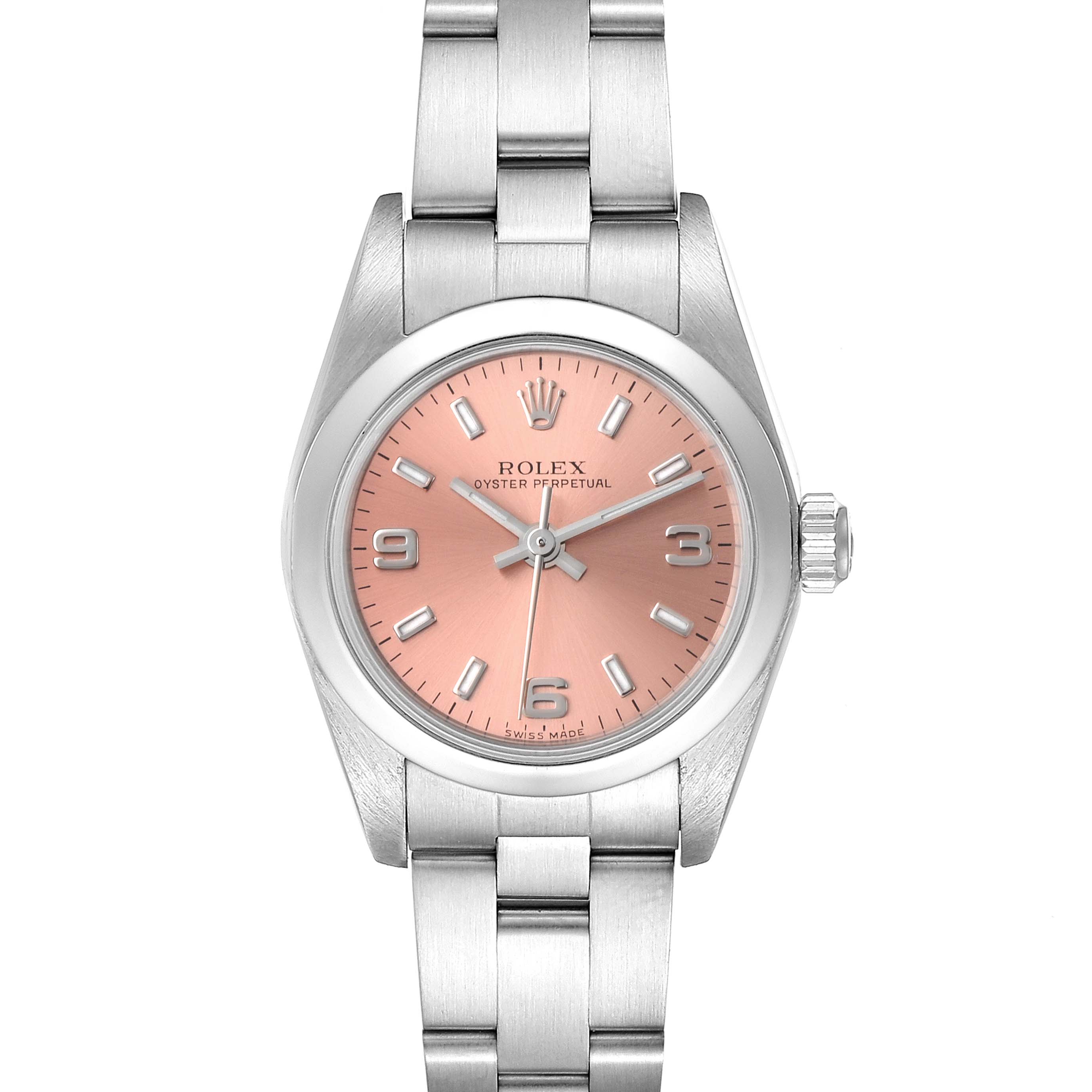The image shows a front view of a Rolex Oyster Perpetual 76080 Women
s Stainless Steel Pink Dial 76080 Women
s Stainless Steel Pink Dial watch with a pink dial and stainless steel bracelet.