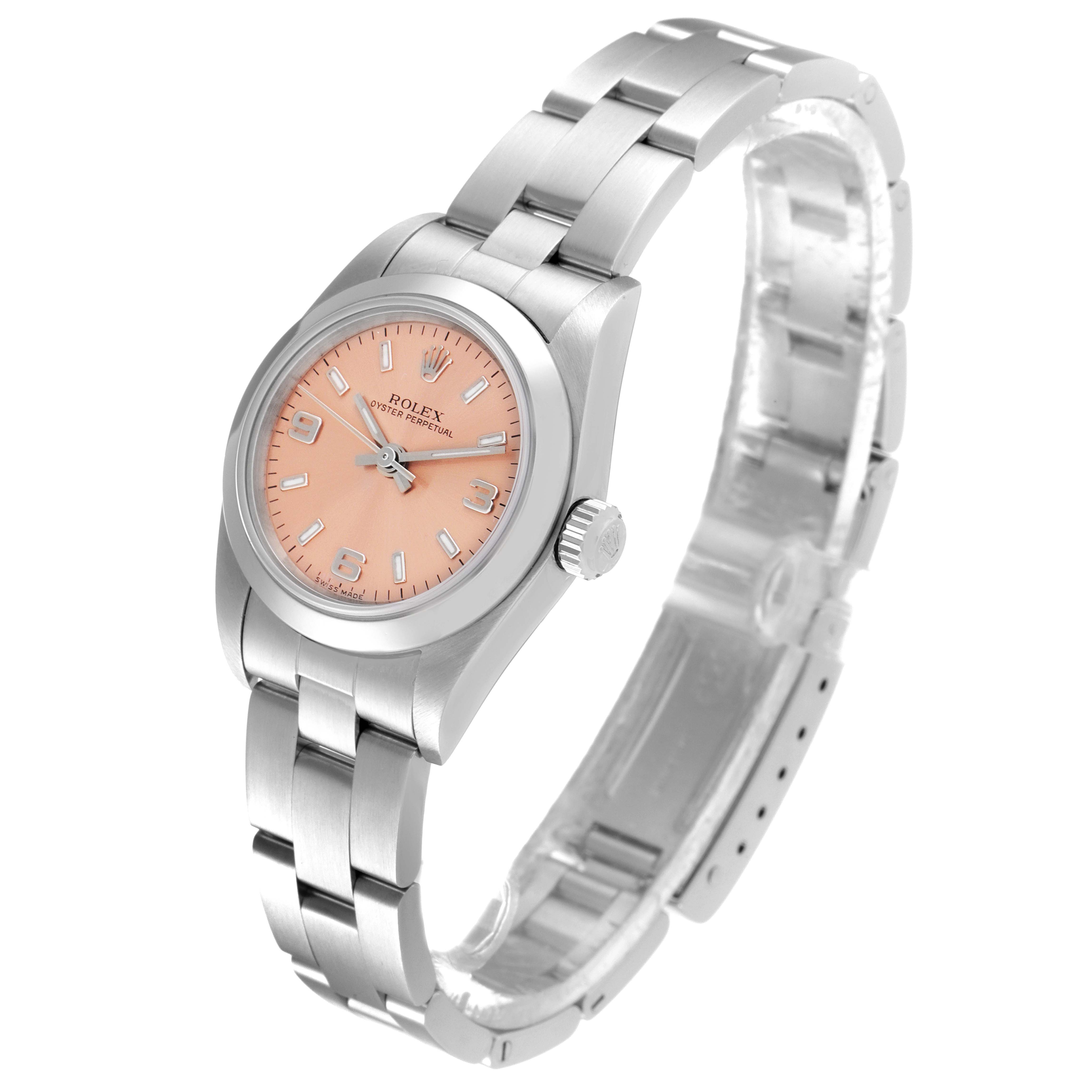 The image shows a Rolex Oyster Perpetual 76080 Women
s Stainless Steel Pink Dial 76080 Women
s Stainless Steel Pink Dial watch at a slight angle, highlighting its face, bezel, and metal bracelet.