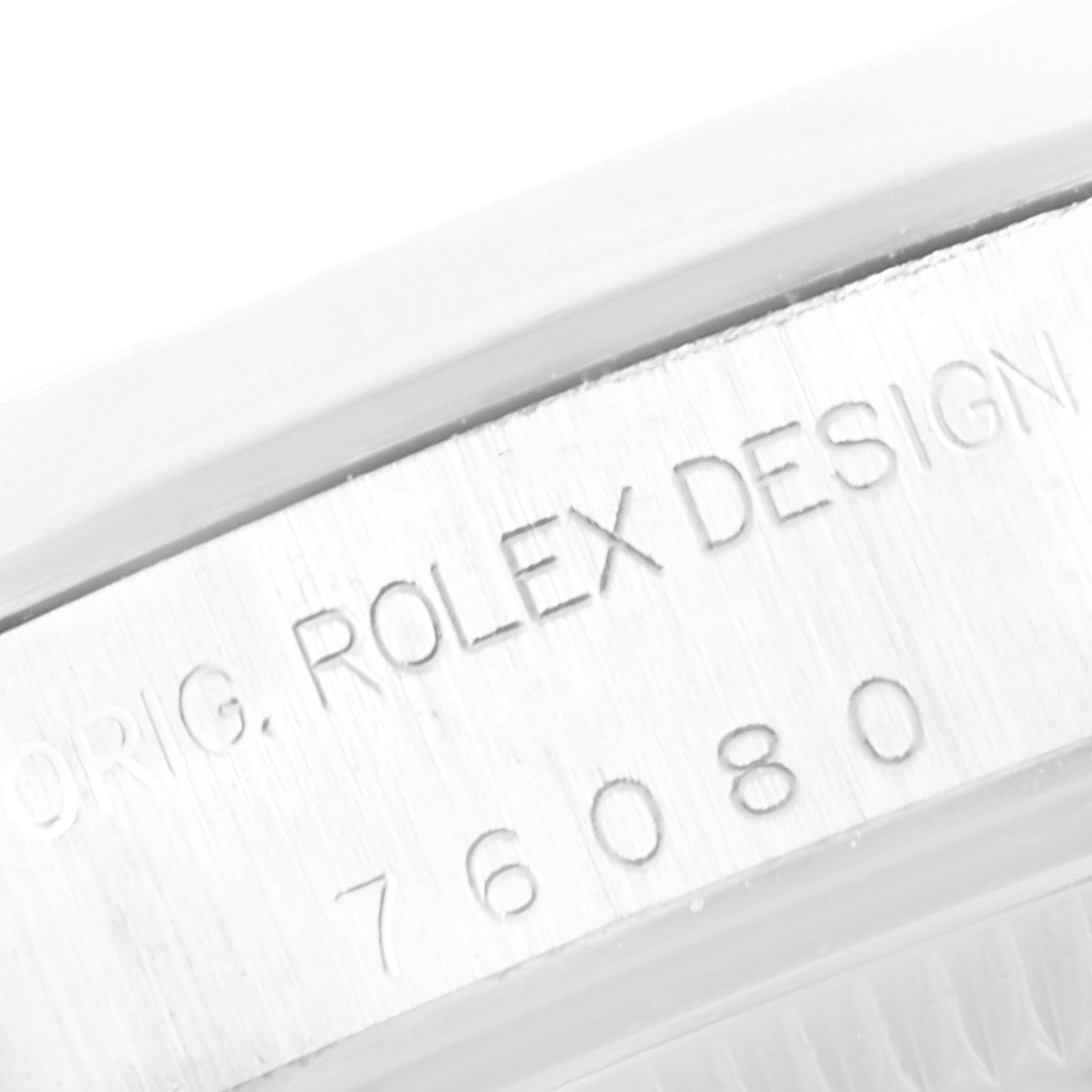 This image shows a close-up of the serial number engraving on the case side of a Rolex Oyster Perpetual 76080 Women
s Stainless Steel Pink Dial 76080 Women
s Stainless Steel Pink Dial watch.