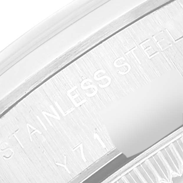 This image shows a close-up of the stainless steel case back of a Rolex Oyster Perpetual 76080 Women
s Stainless Steel Pink Dial 76080 Women
s Stainless Steel Pink Dial.