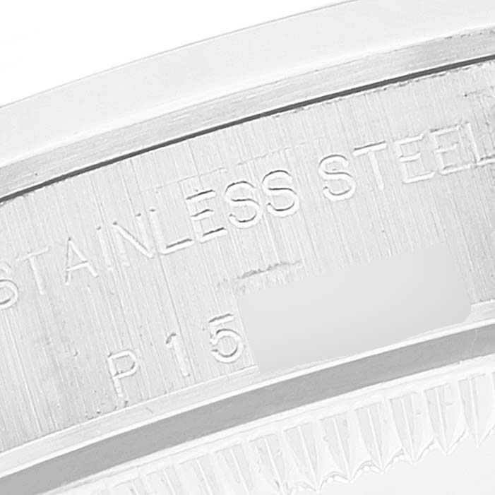 This image shows a close-up of the case back edge of a Rolex Oyster Perpetual 76080 Women's Stainless Steel White Dial 76080 Women's Stainless Steel White Dial watch, highlighting the stainless steel engraving.