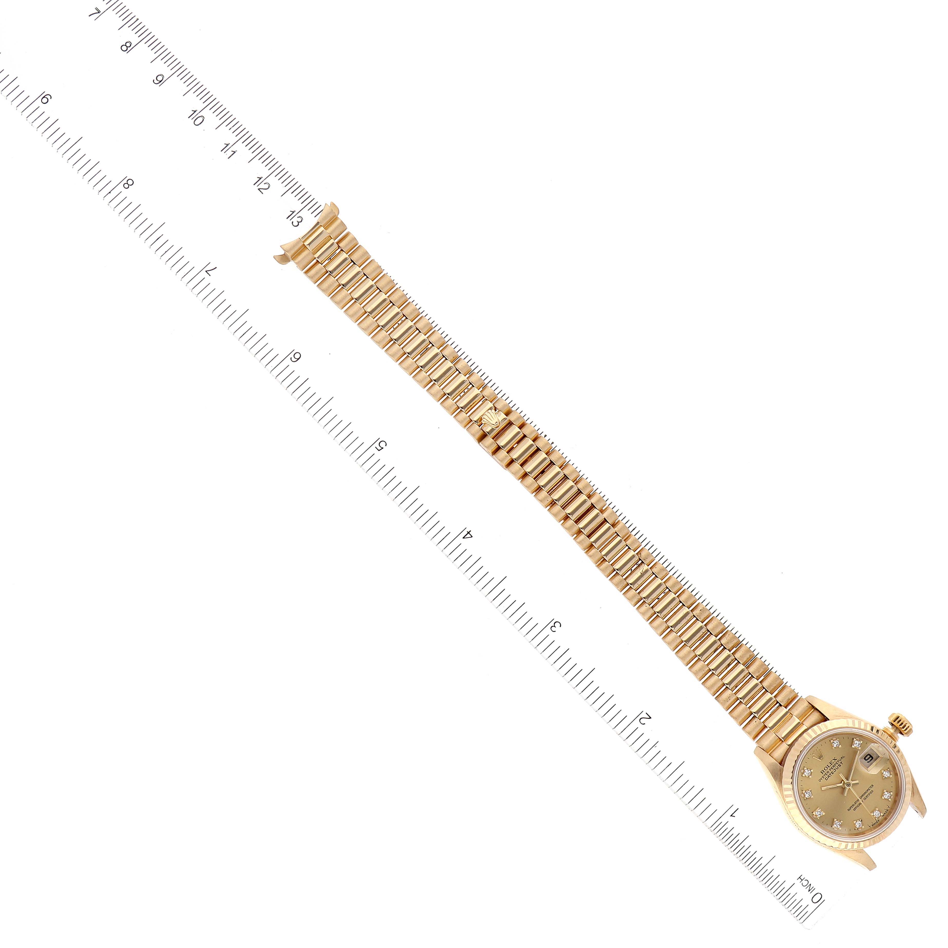 The image shows a Rolex President 69178 Women
s Yellow Gold Champagne Dial 69178 Women
s Yellow Gold Champagne Dial model watch from a top-down angle, including the dial, case, and full bracelet.
