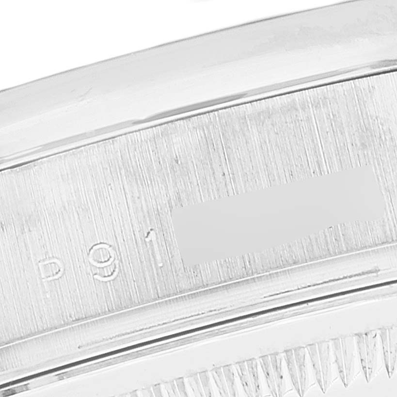 This close-up image shows the side of the President model Rolex watch, highlighting the serial number engraving.
