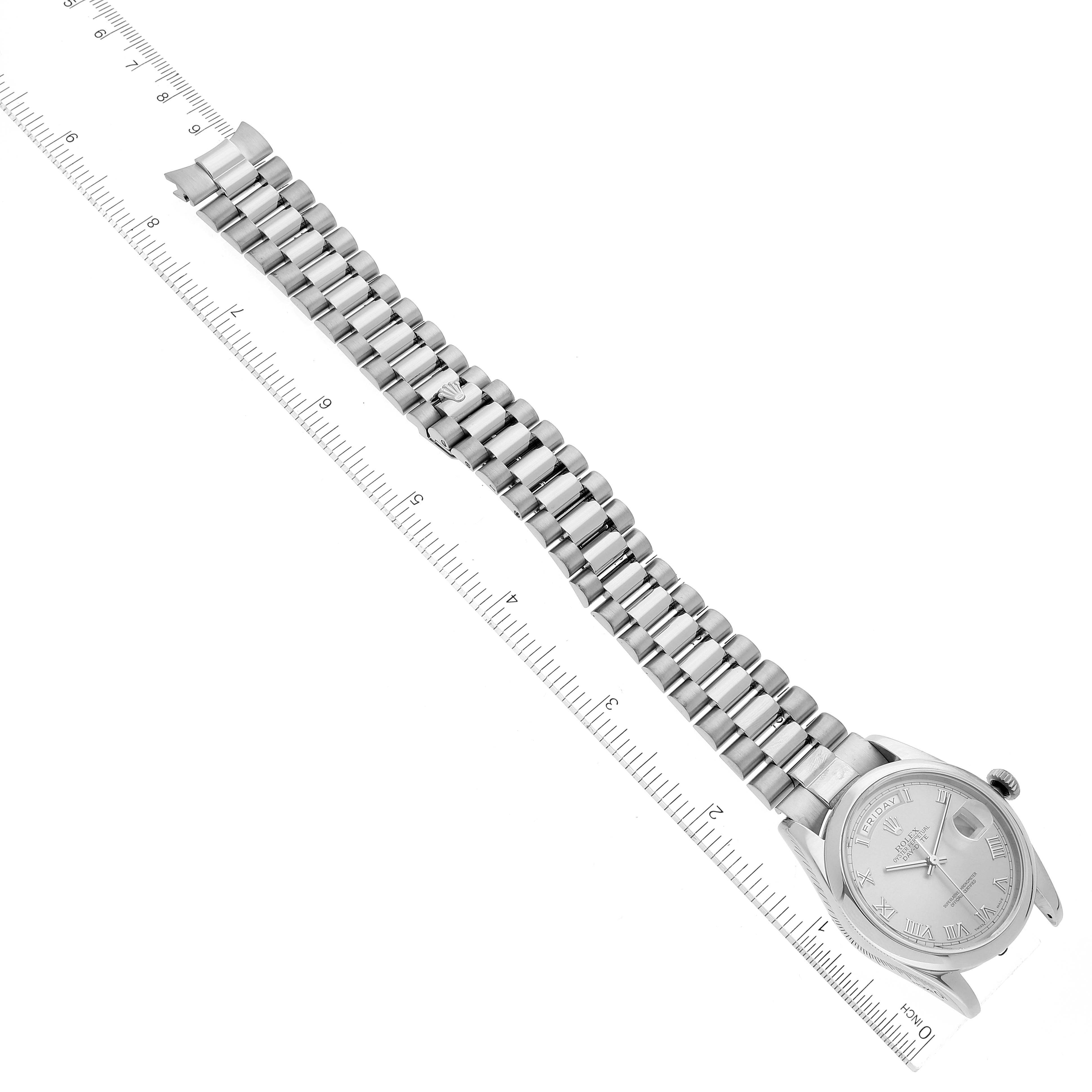 The image shows a top-down view of a Rolex President 118209 Men's White Gold Silver Dial 118209 Men's White Gold Silver Dial model watch, highlighting its full bracelet and dial.