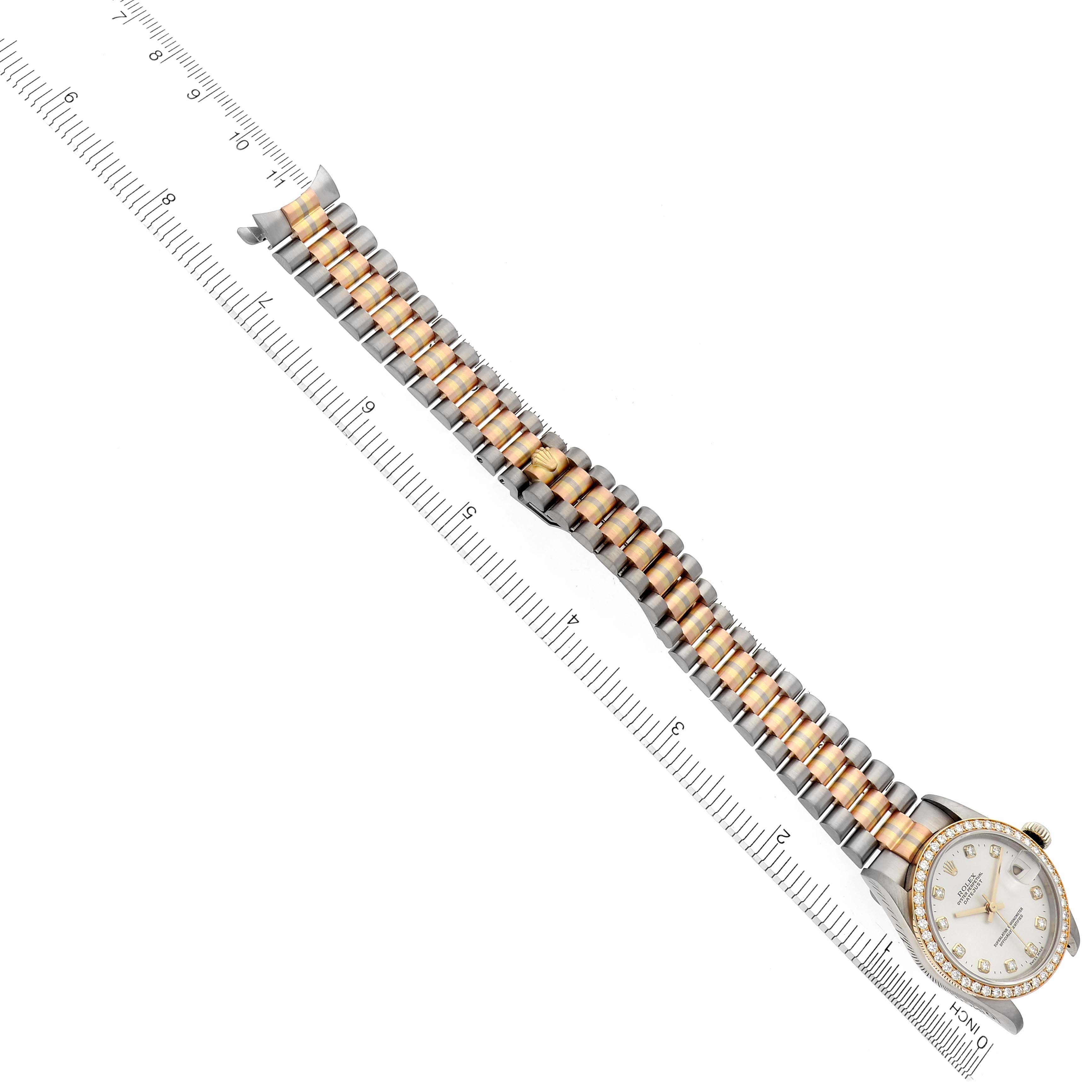 The Rolex President 68289 Women's White Gold Silver Dial 68289 Women's White Gold Silver Dial watch is shown diagonally, featuring its band and partially visible face next to a ruler.