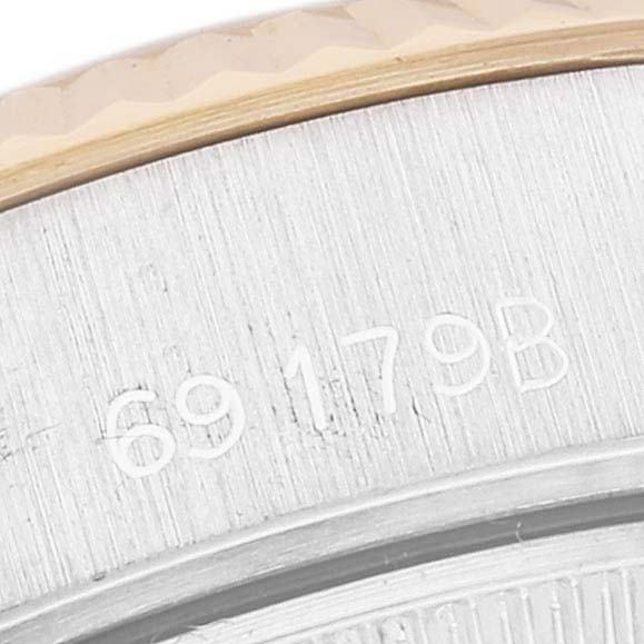 This close-up shows the serial number on the case back of a Rolex President 69179G Women
s White Gold Champagne Dial 69179G Women
s White Gold Champagne Dial model watch.