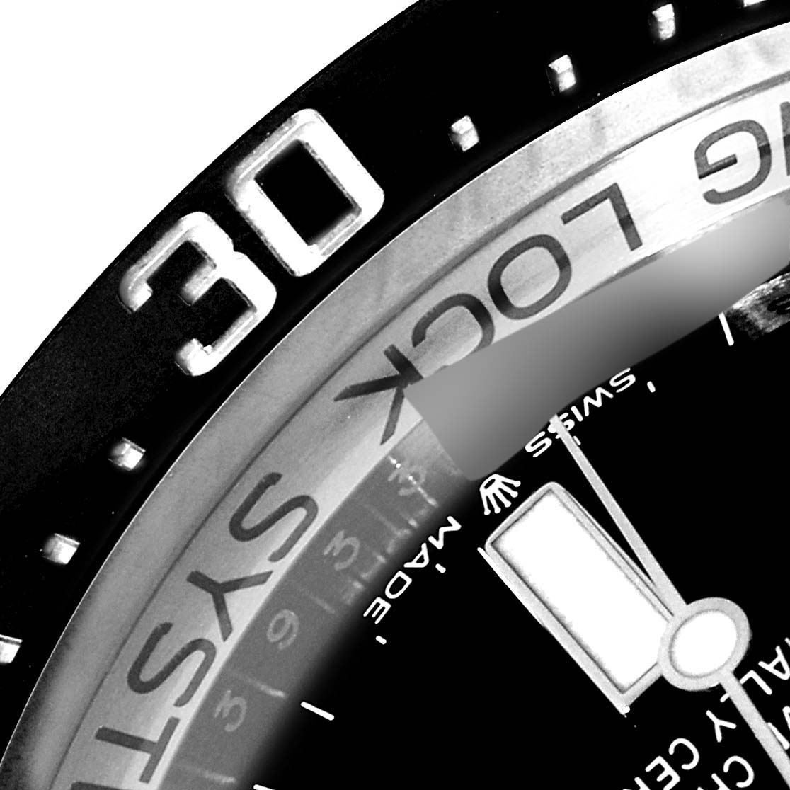 This image shows a close-up of the bezel, part of the dial, and the "30" minute marker of a Rolex Sea-Dweller 126660 Men
s Stainless Steel Blue Dial 126660 Men
s Stainless Steel Blue Dial watch.