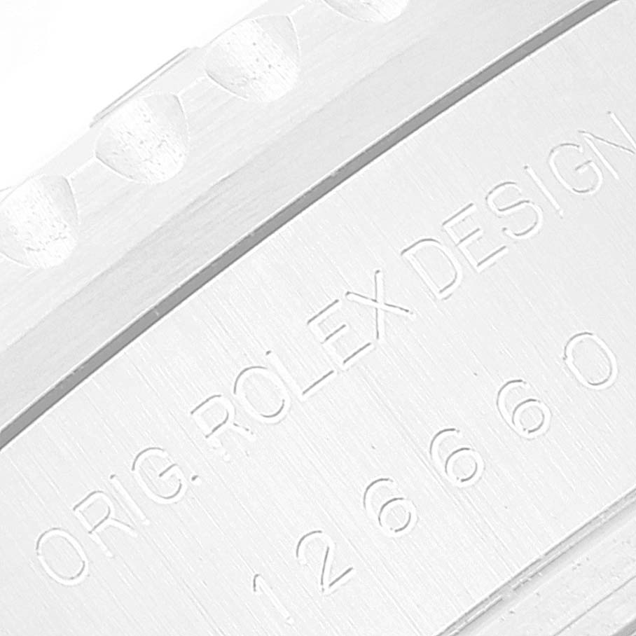 This image shows a close-up of the engravings on the side of the Rolex Sea-Dweller 126660 Men
s Stainless Steel Blue Dial 126660 Men
s Stainless Steel Blue Dial watch, displaying "ORIG. ROLEX DESIGN 126660."