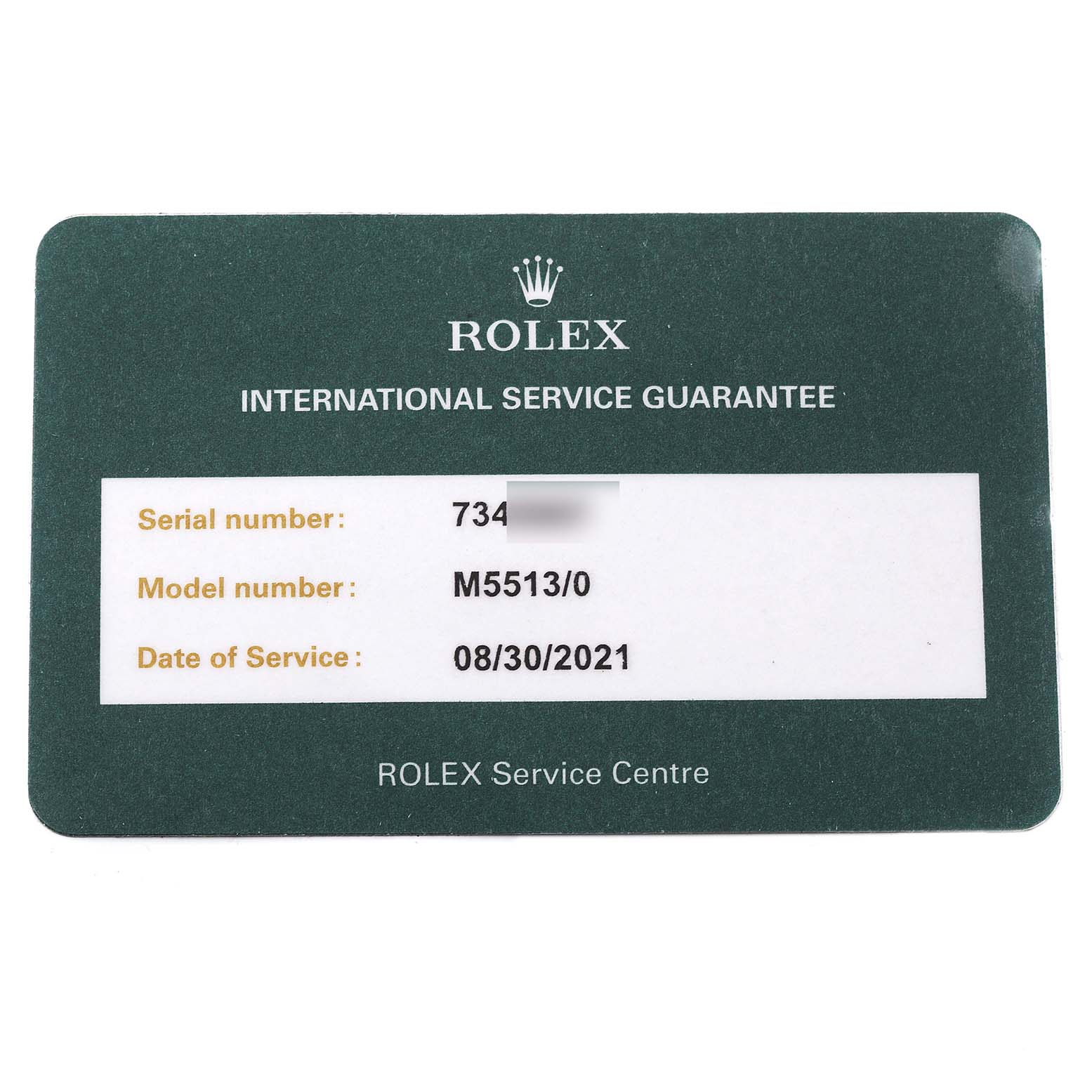 The image shows a Rolex International Service Guarantee card for the Submariner model, detailing the serial number, model number, and date of service.