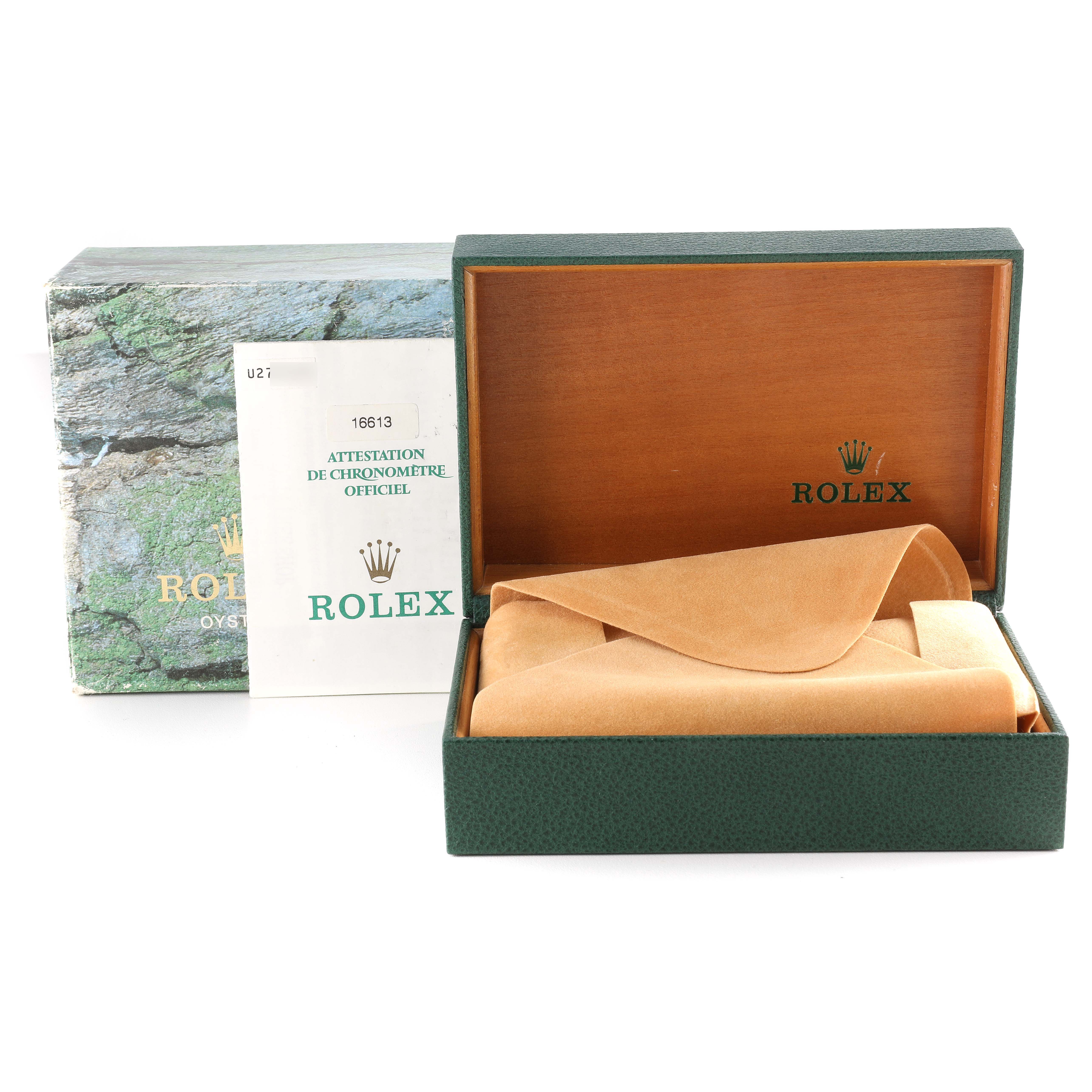 The image shows the packaging and accessories for a Rolex Submariner 16613 Men
s Steel and Gold (two tone) Blue Dial 16613 Men
s Steel and Gold (two tone) Blue Dial watch, including the box, documentation, and watch case.