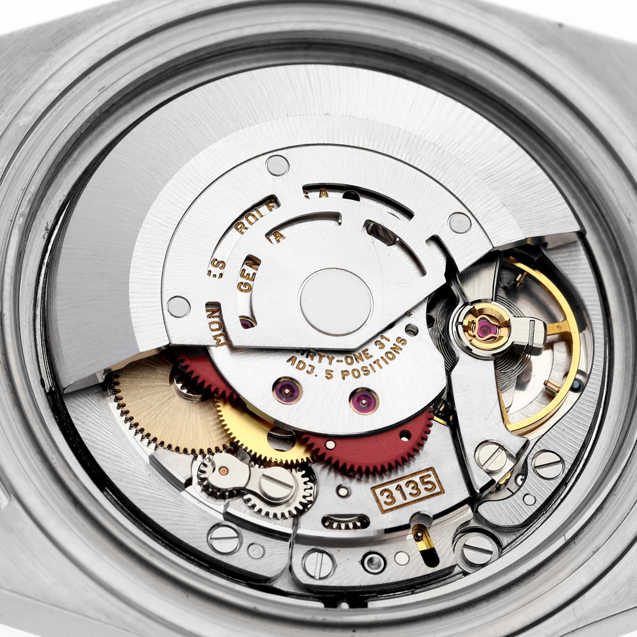 This image shows a detailed view of the movement and mechanical components inside a Rolex Submariner 16613 Men
s Steel and Gold (two tone) Blue Dial 16613 Men
s Steel and Gold (two tone) Blue Dial watch.