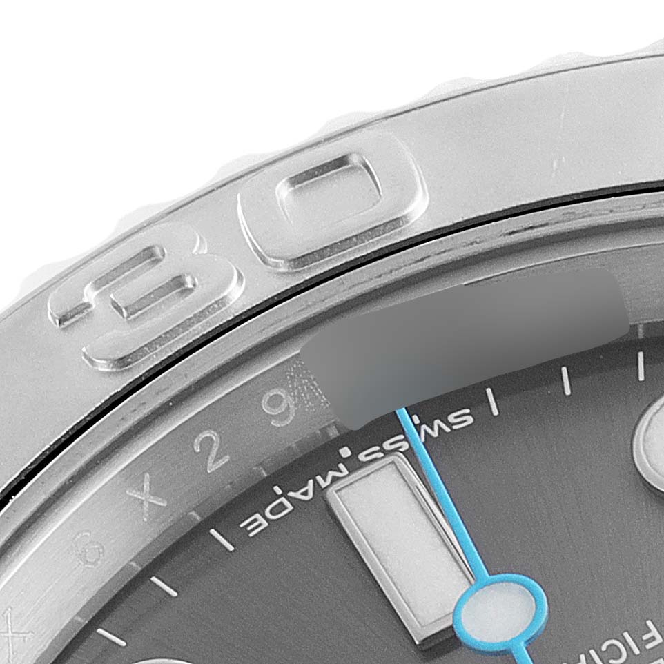 This close-up of the Rolex Yacht-Master 116622 Men's Stainless Steel Grey Dial 116622 Men's Stainless Steel Grey Dial watch shows the bezel with the number "30," part of the dial, and the seconds hand.