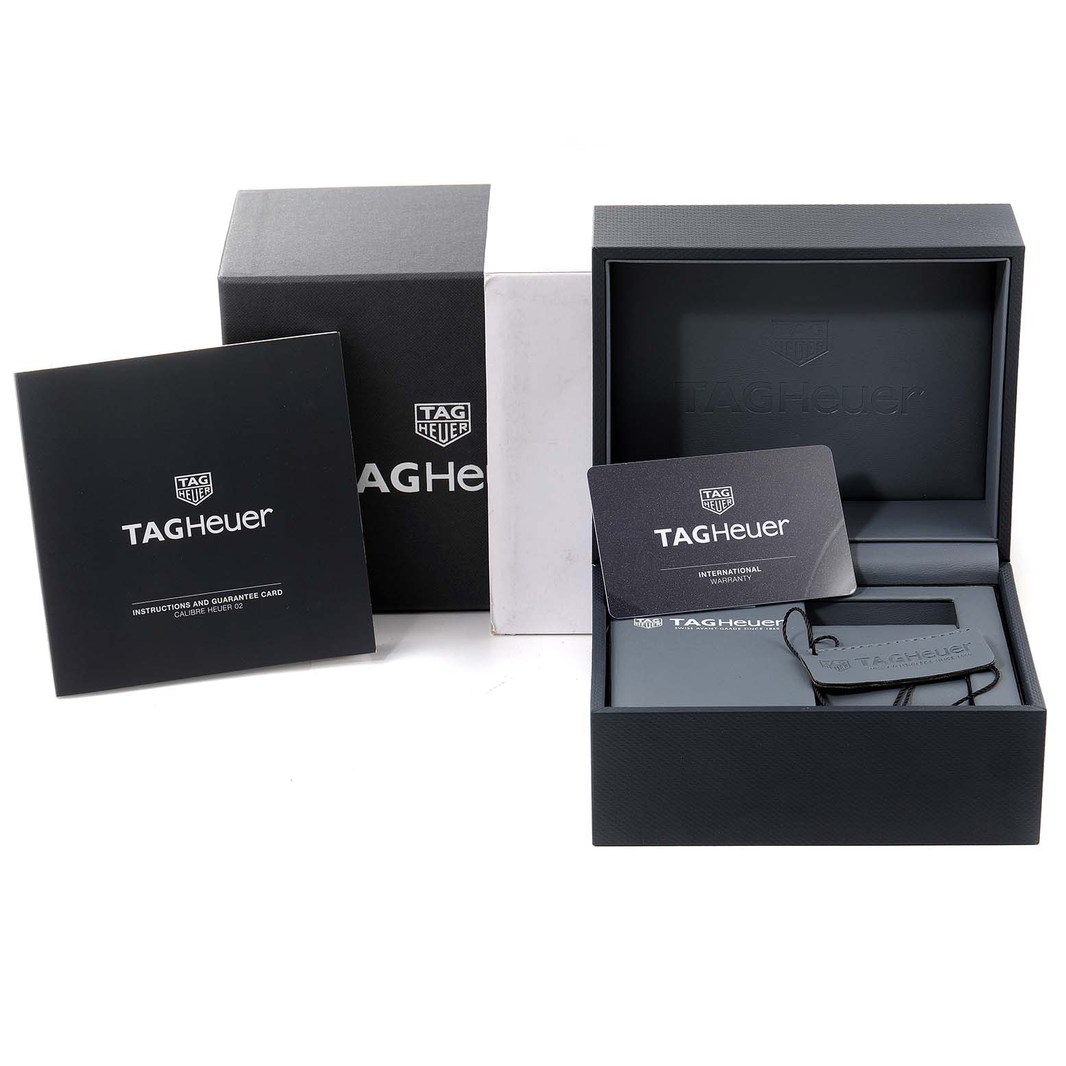 The image shows the packaging, guarantee card, and instructions for a Tag Heuer Monaco CBL2111.FC6453 Men's Stainless Steel Blue Dial CBL2111.FC6453 Men's Stainless Steel Blue Dial watch.