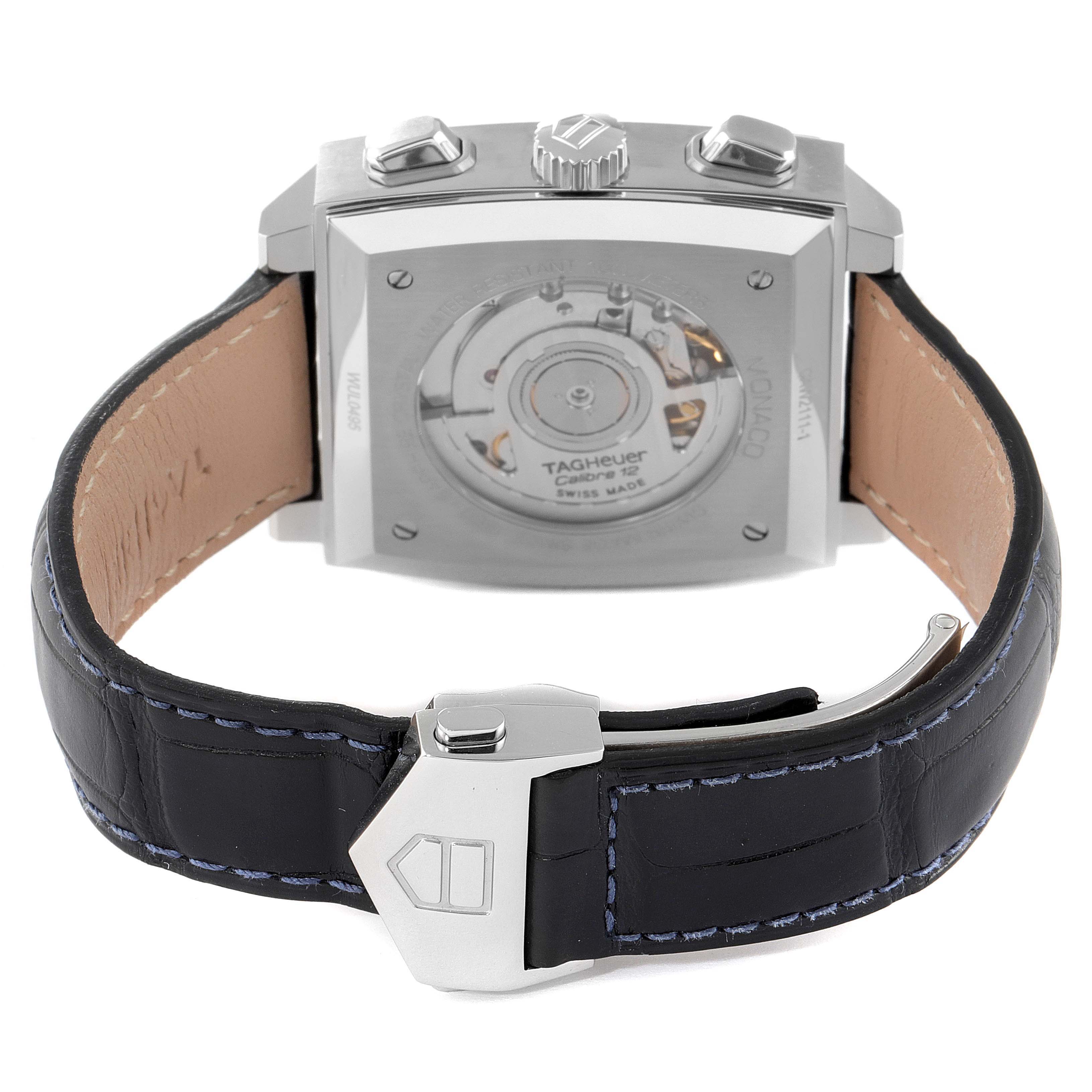 The image shows the back view of a Tag Heuer Monaco CAW2111 Men's Stainless Steel Blue Dial CAW2111 Men's Stainless Steel Blue Dial watch, displaying its movement and black leather strap.
