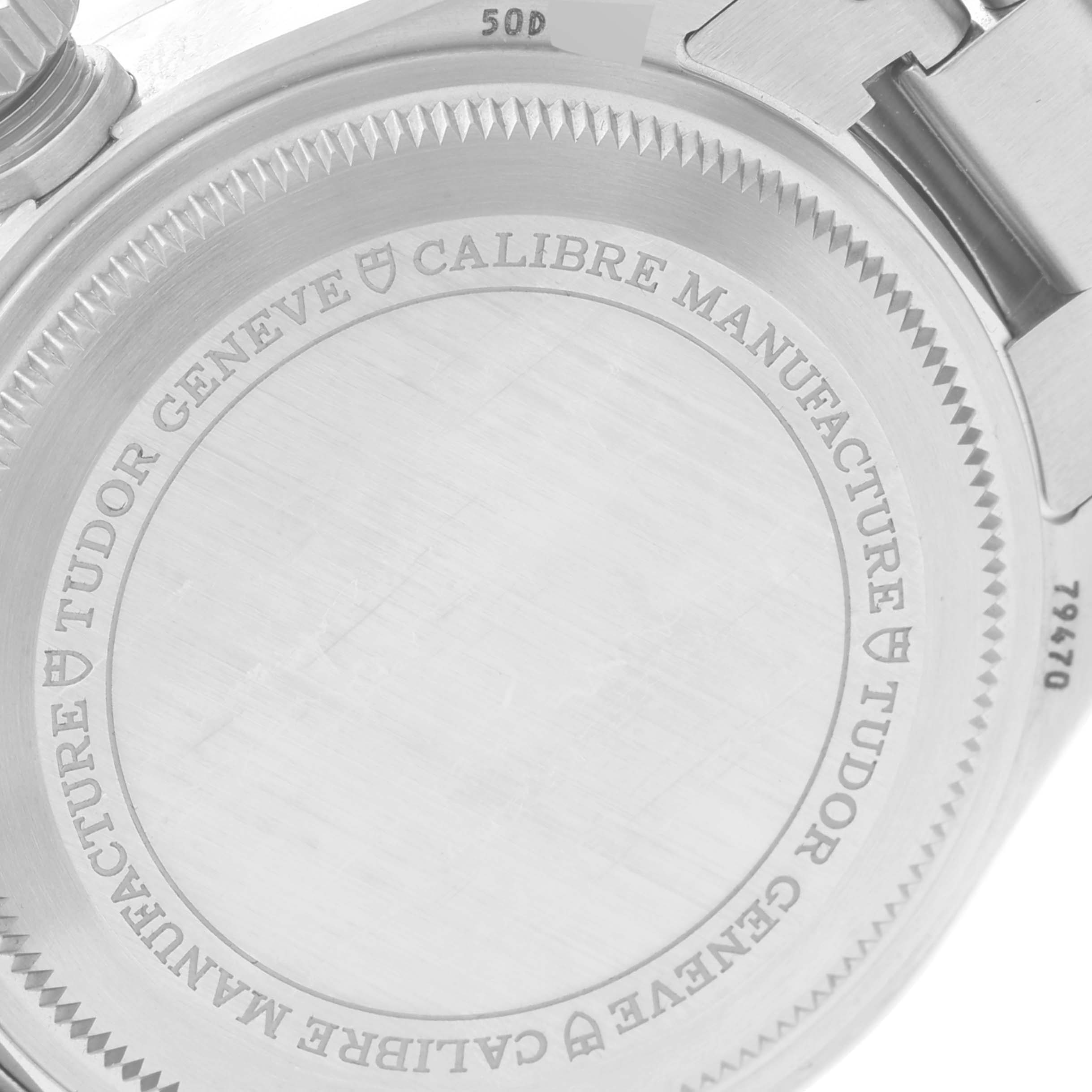 The image displays the engraved back case of the Tudor Heritage Black Bay M79470 Men
s Stainless Steel Black Dial M79470 Men
s Stainless Steel Black Dial watch from an oblique angle.