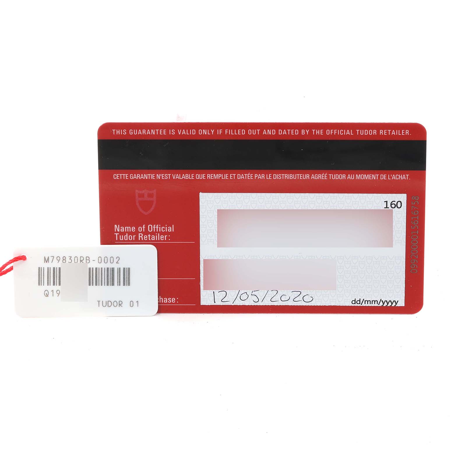 The image shows a warranty card and tag for the Tudor Heritage Black Bay 79830RB Men
s Stainless Steel Black Dial 79830RB Men
s Stainless Steel Black Dial watch.