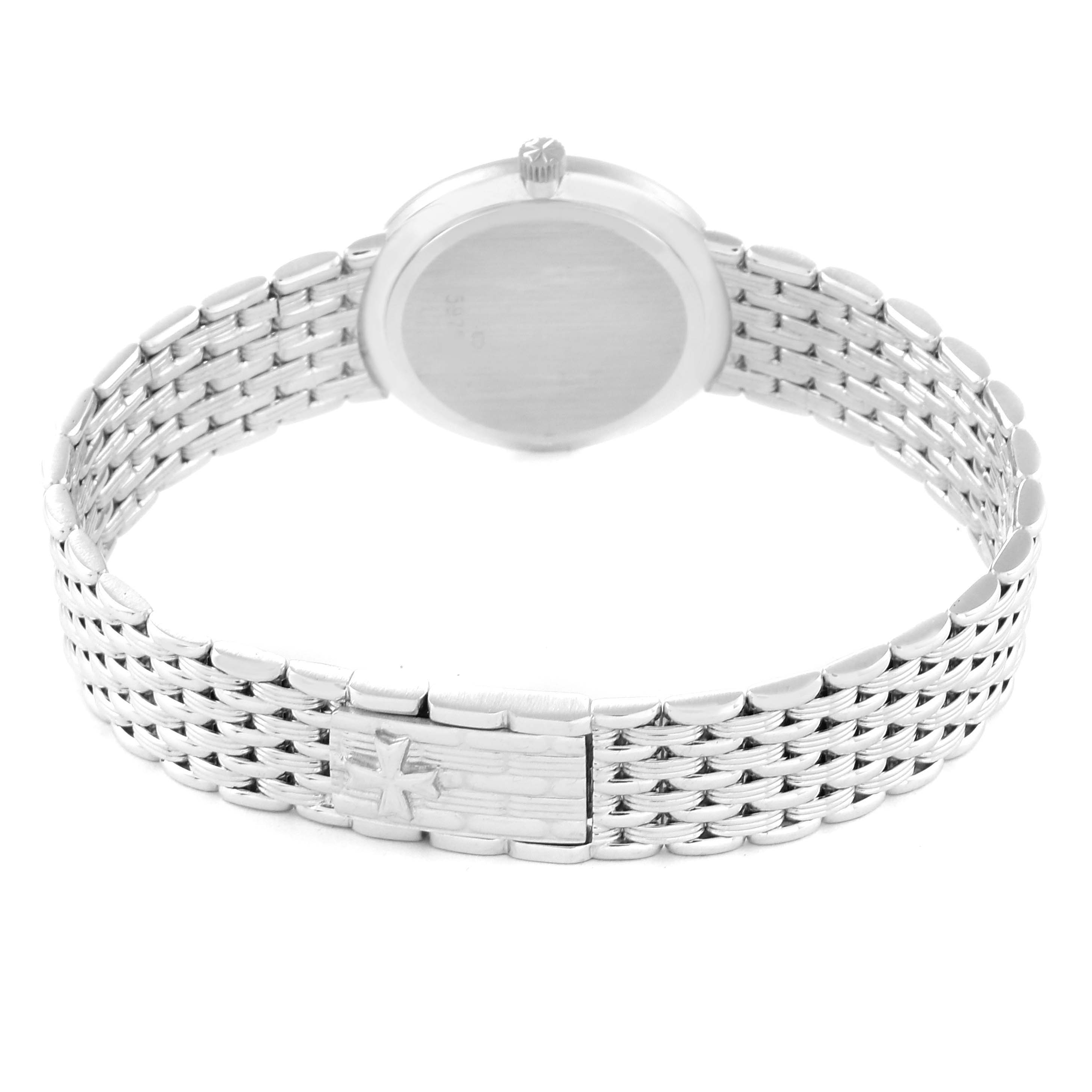 The image shows the back view of a Vacheron Constantin Traditionnelle 27093 Women
s White Gold White Dial 27093 Women
s White Gold White Dial watch, highlighting its metal strap and clasp.