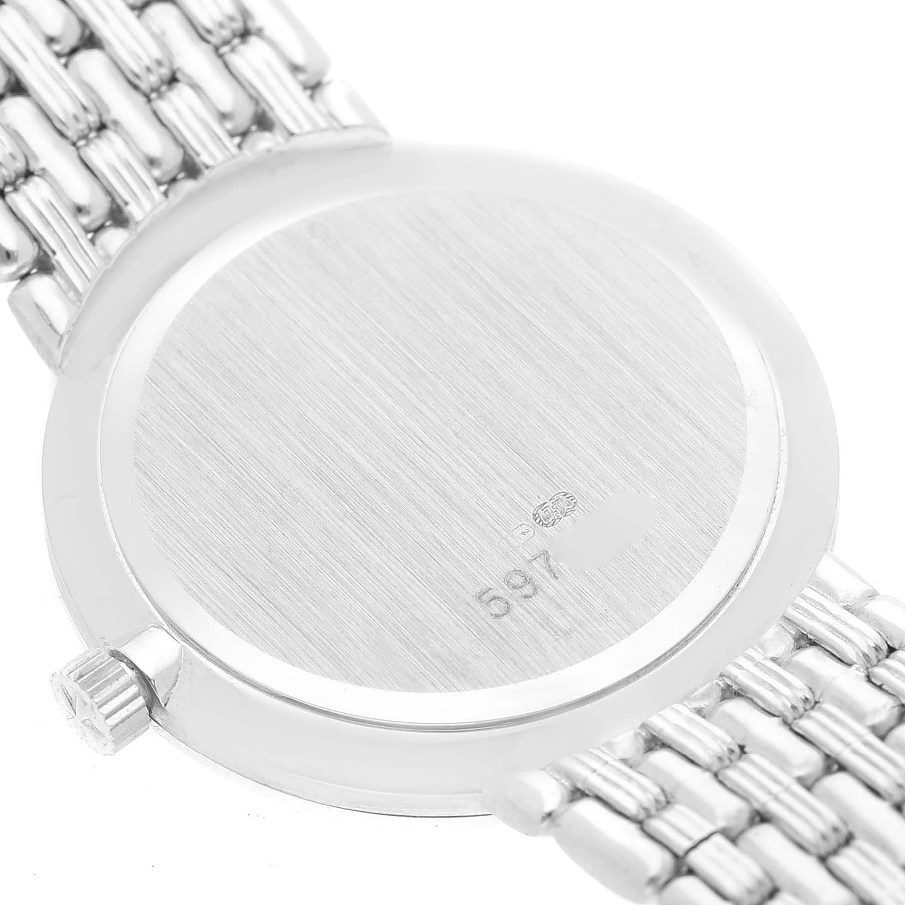 The image shows the back case and part of the metal strap of the Traditionnelle model by Vacheron Constantin.