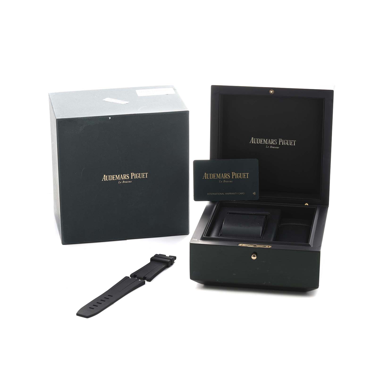 The image shows the Audemars Piguet Royal Oak Offshore 15710ST.00.A002CA.02 Men's Stainless Steel White Dial packaging with a watch box, an extra strap, and a warranty card.