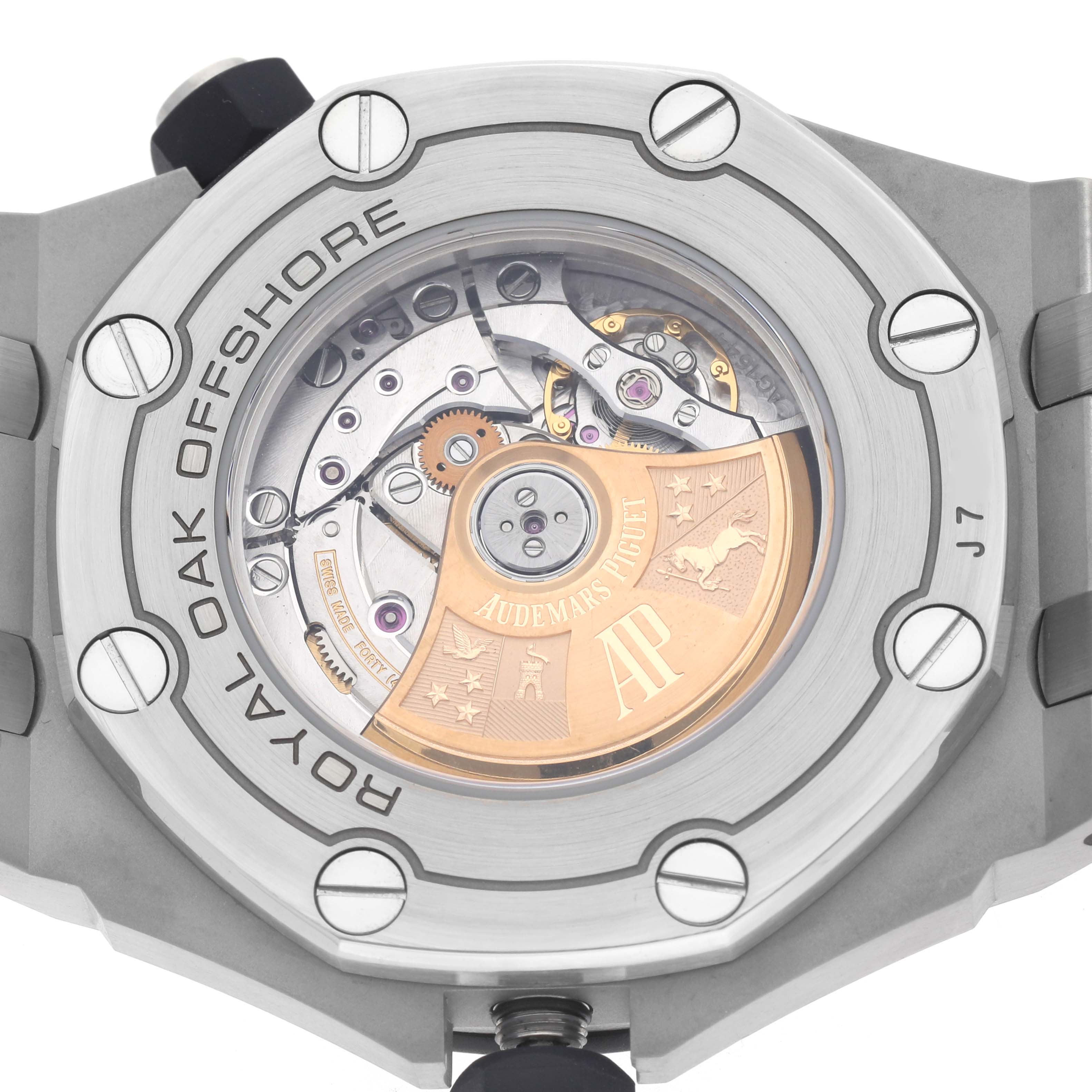 The image shows the back of the Audemars Piguet Royal Oak Offshore 15710ST.00.A002CA.02 Men's Stainless Steel White Dial, highlighting the movement and rotor.