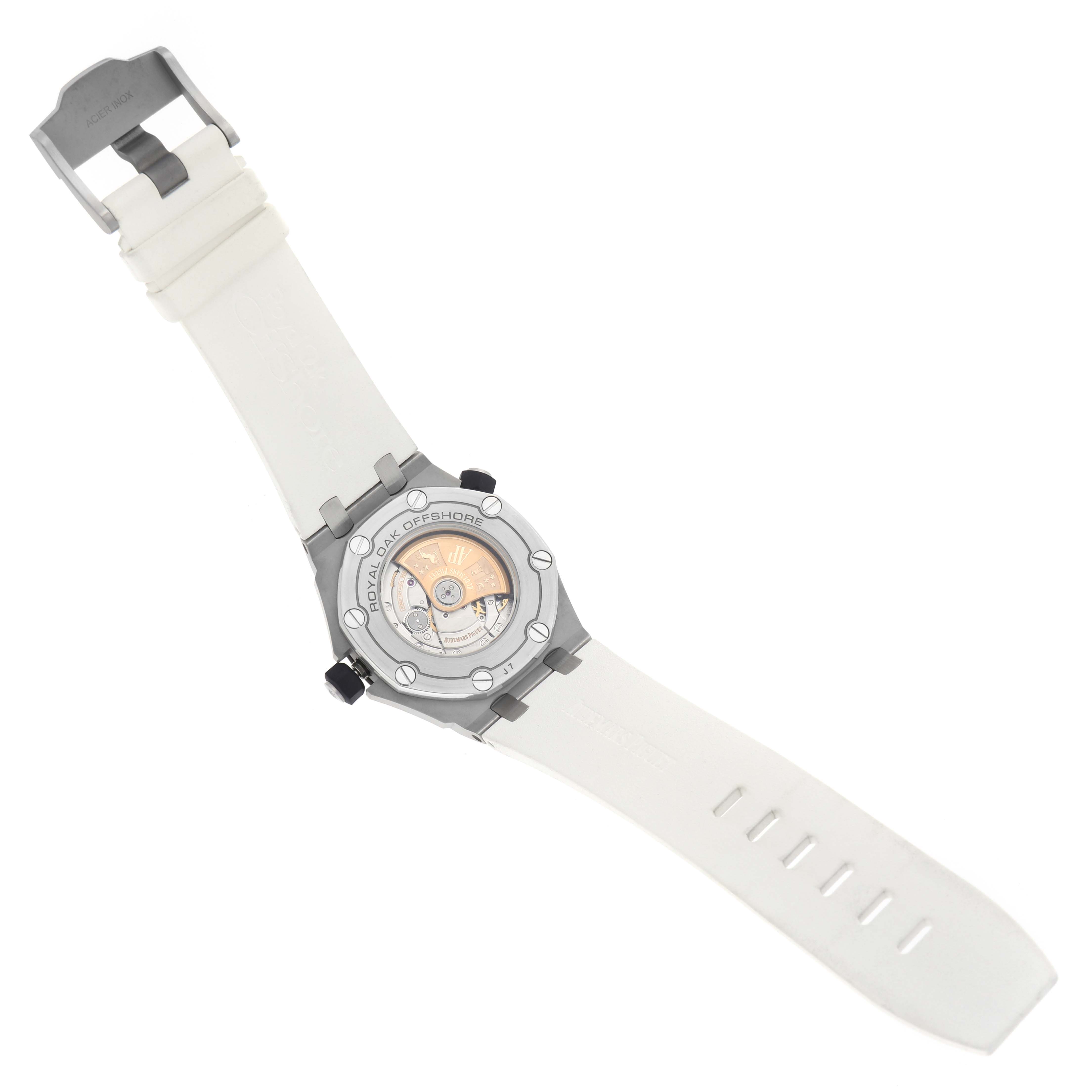 The image shows the back of an Audemars Piguet Royal Oak Offshore 15710ST.00.A002CA.02 Men's Stainless Steel White Dial watch, displaying its movement and a white strap.